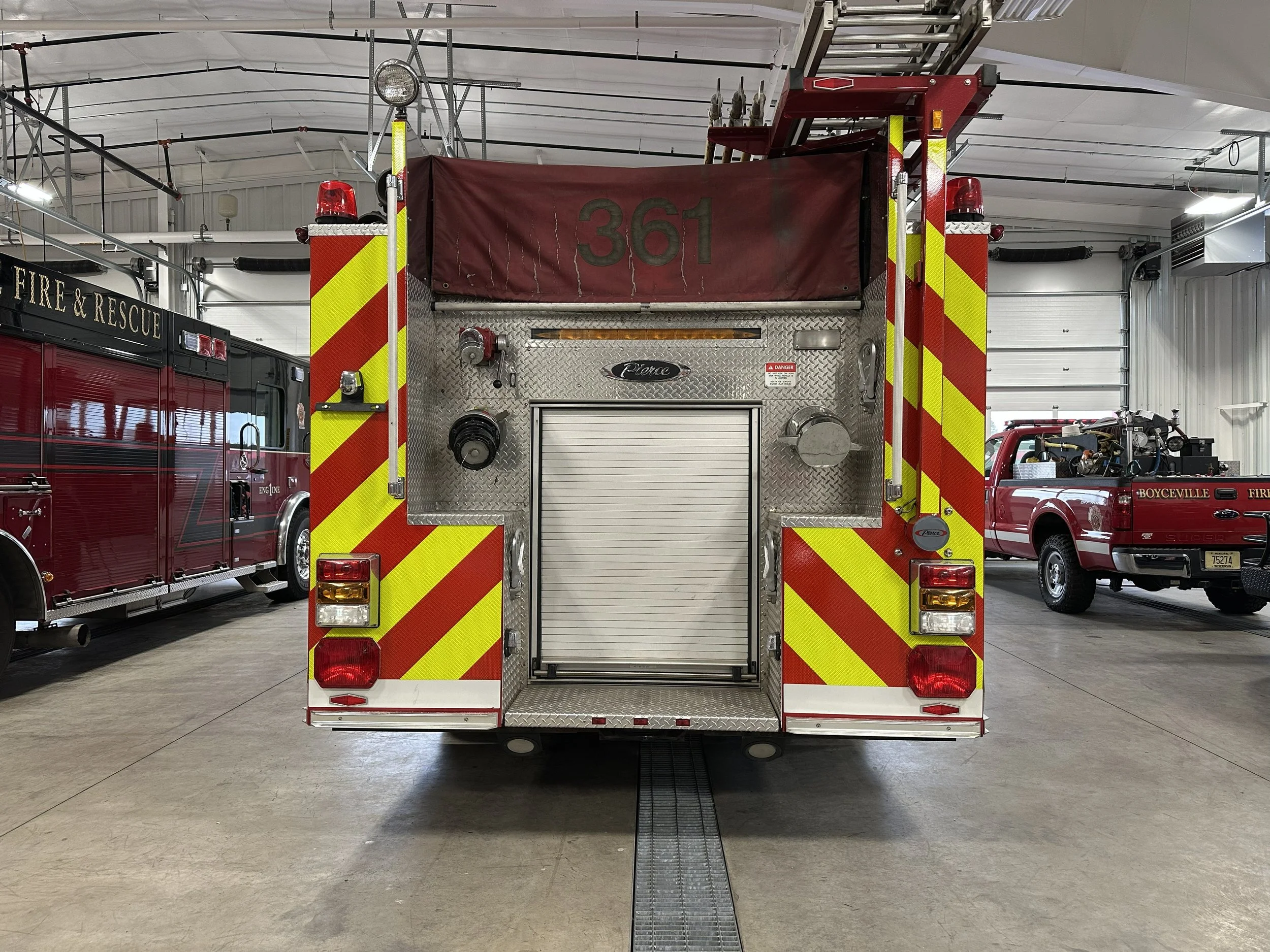 Fire truck with yellow and red reflective stripes
