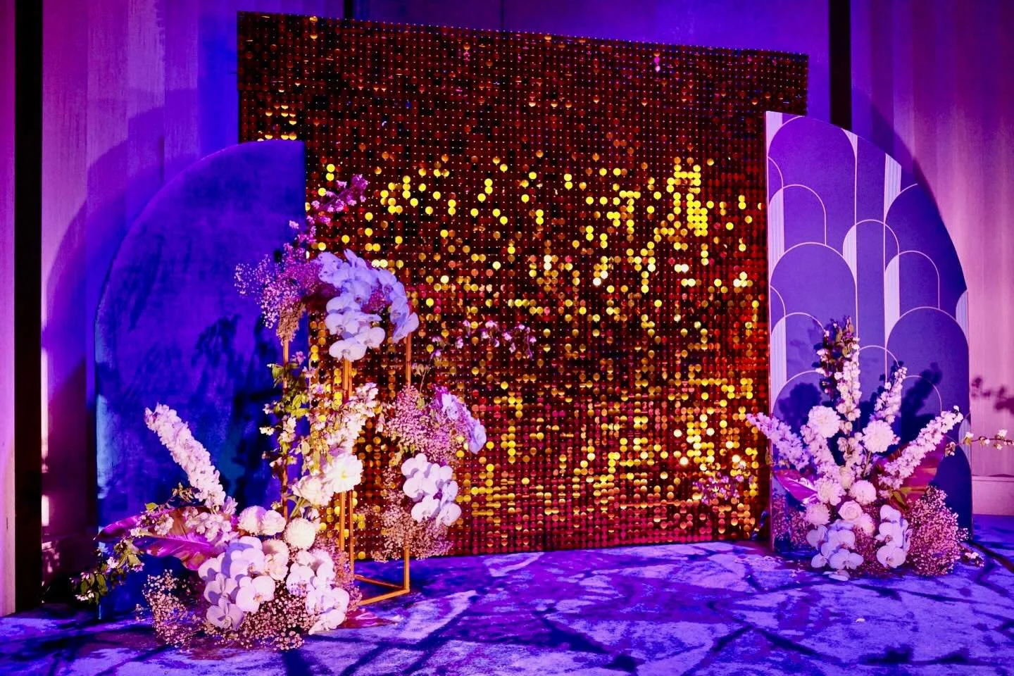 A touch of luxury and a dash of glamour for this client&rsquo;s photo wall. Rich gold tones meet art deco patterns and plush velvet accents, complete with a luxe fresh flower installation.
