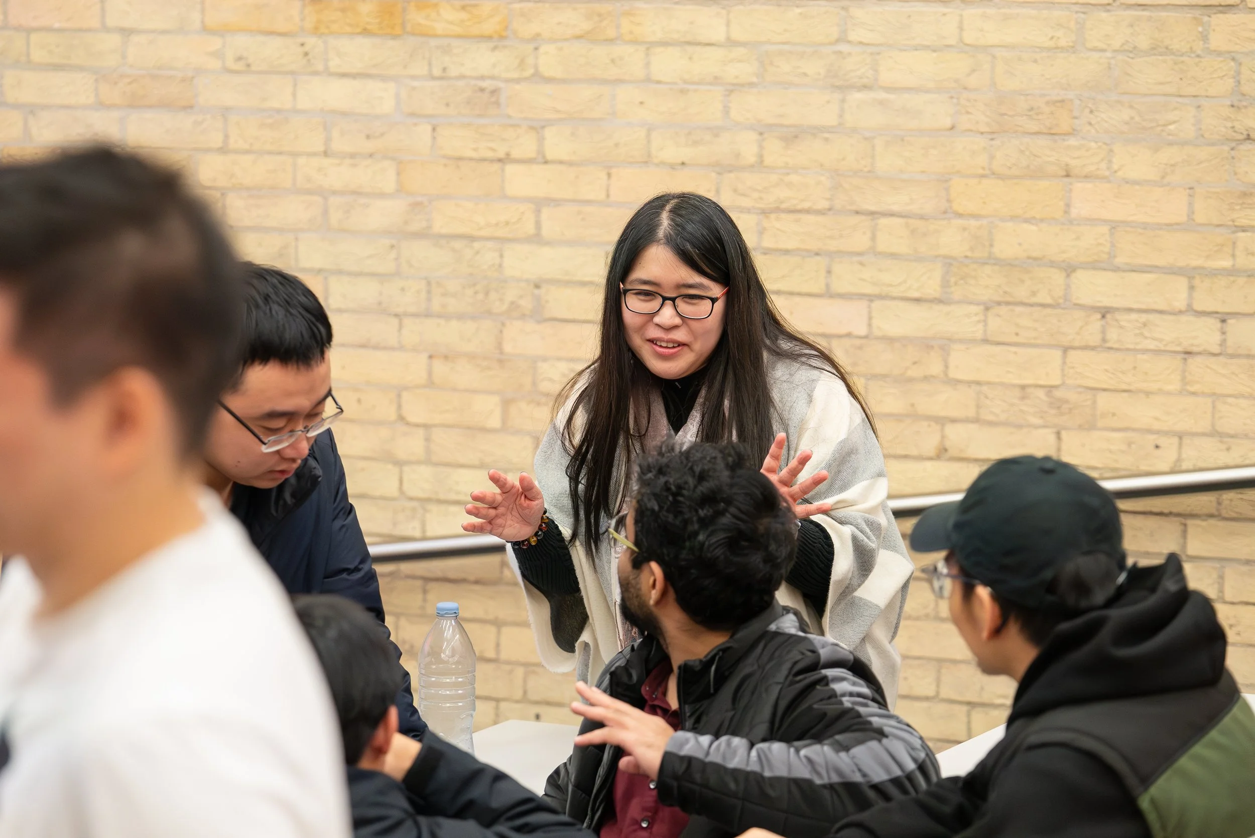 Maharani Hariga speaking with a group during workshop