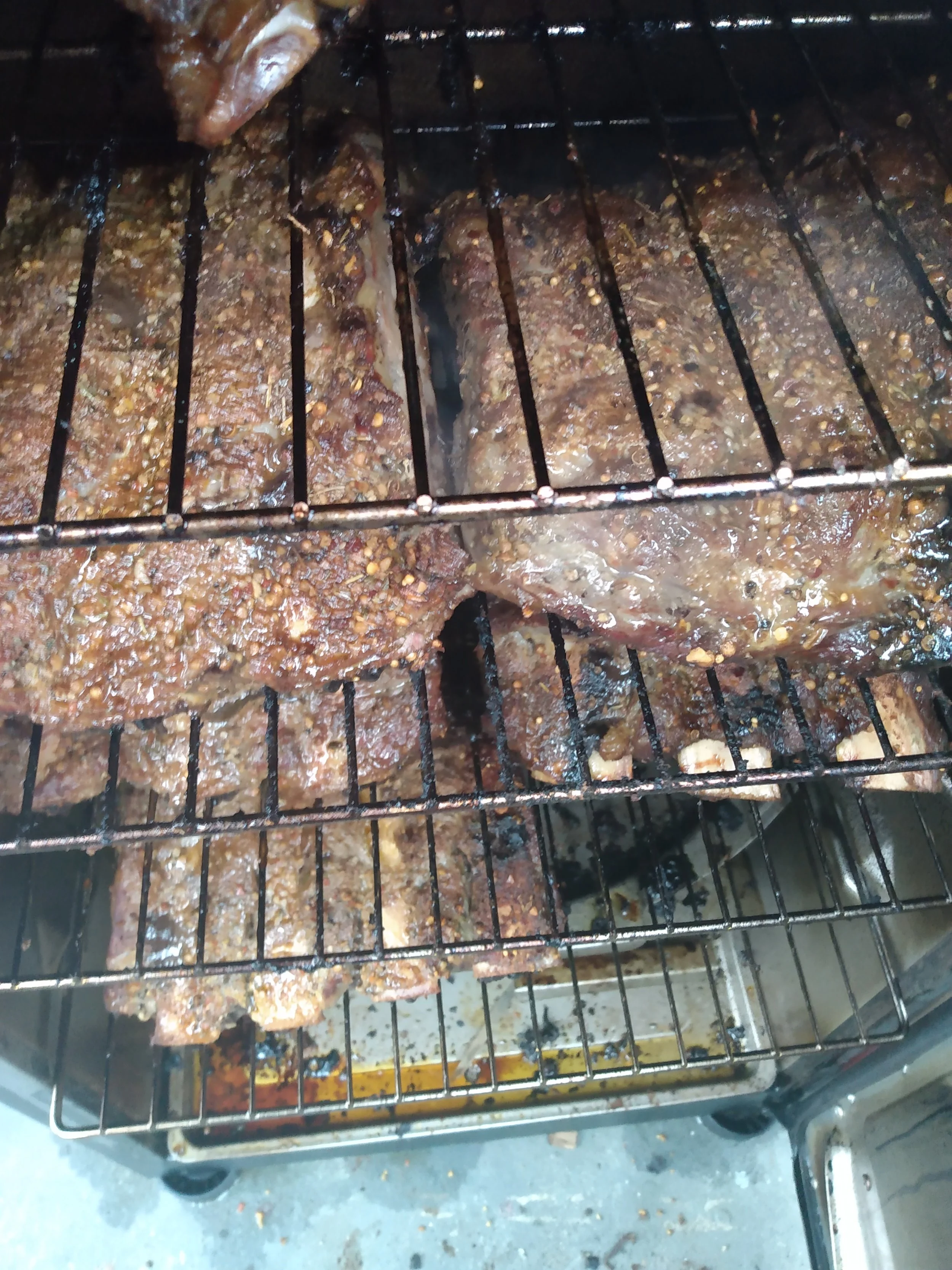 Beef Back Ribs inside a smoker.