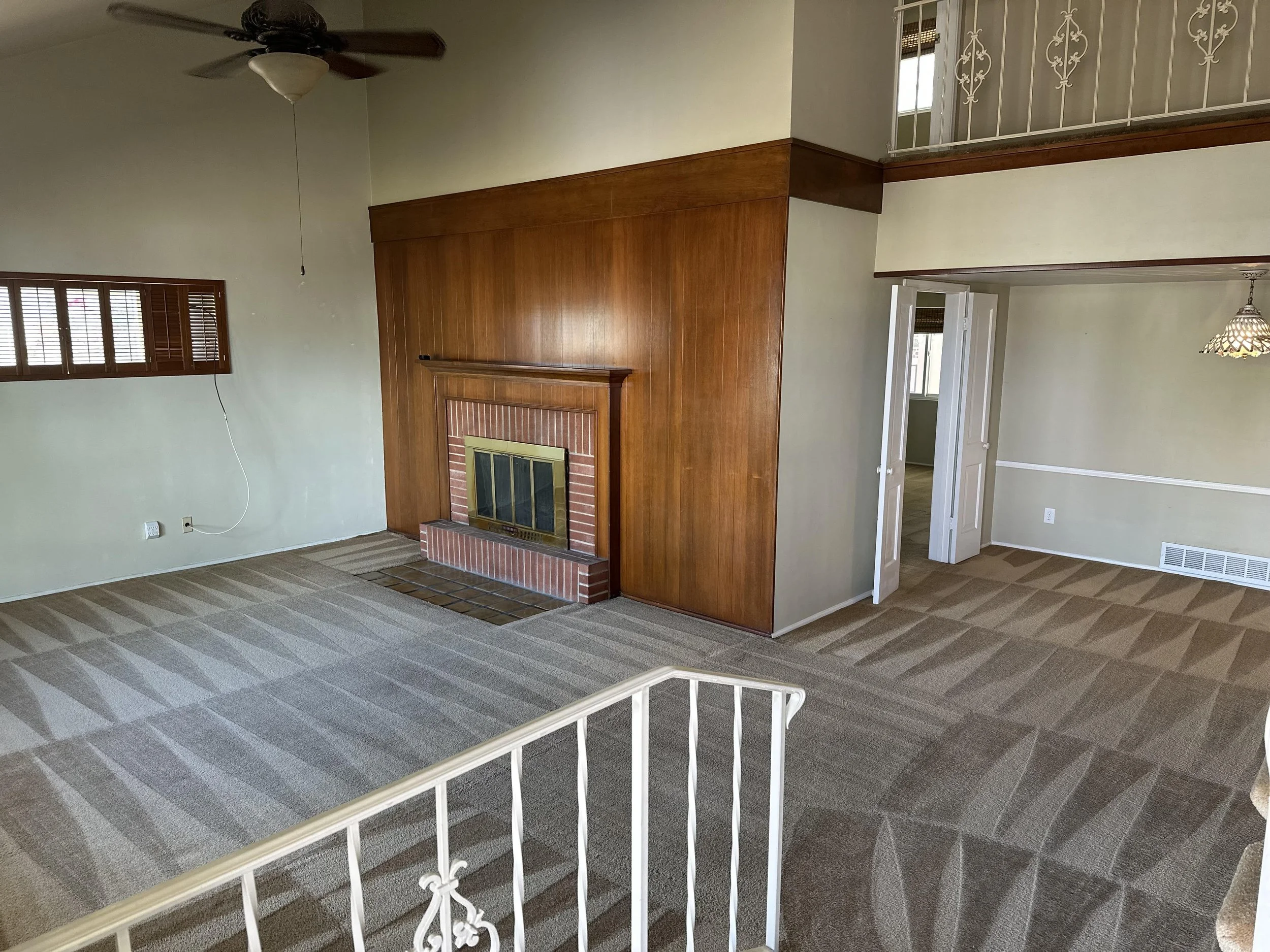 Empty living room with perfectly cleaned carpets with nice triangle patterns on the carpet left from cleaning.