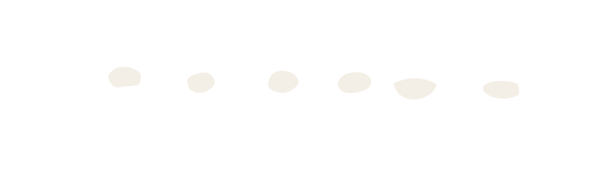 Close-up of a cartoon snowman with a top hat, carrot nose, and stick arms.