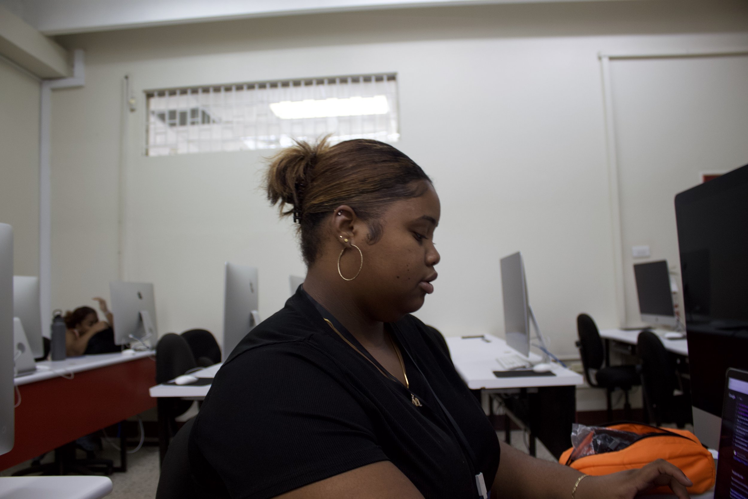 Mikayla Miller working on a Graphics piece.