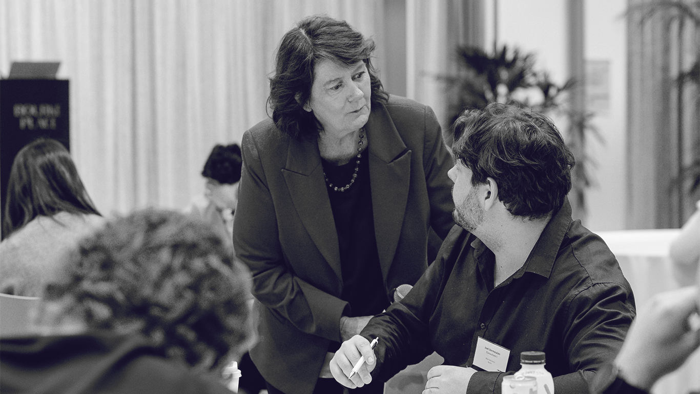 Danette Fenton-Menzies speaking with participant during leadership workshop