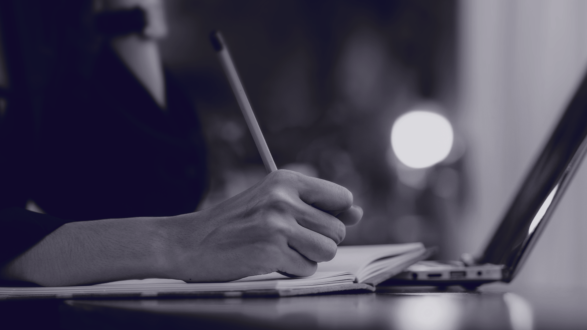 Taking notes during diagnostic assessment with laptop