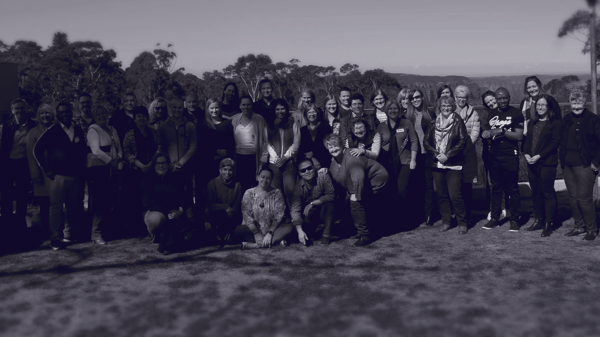 Group of professionals during corporate retreat in outdoor setting