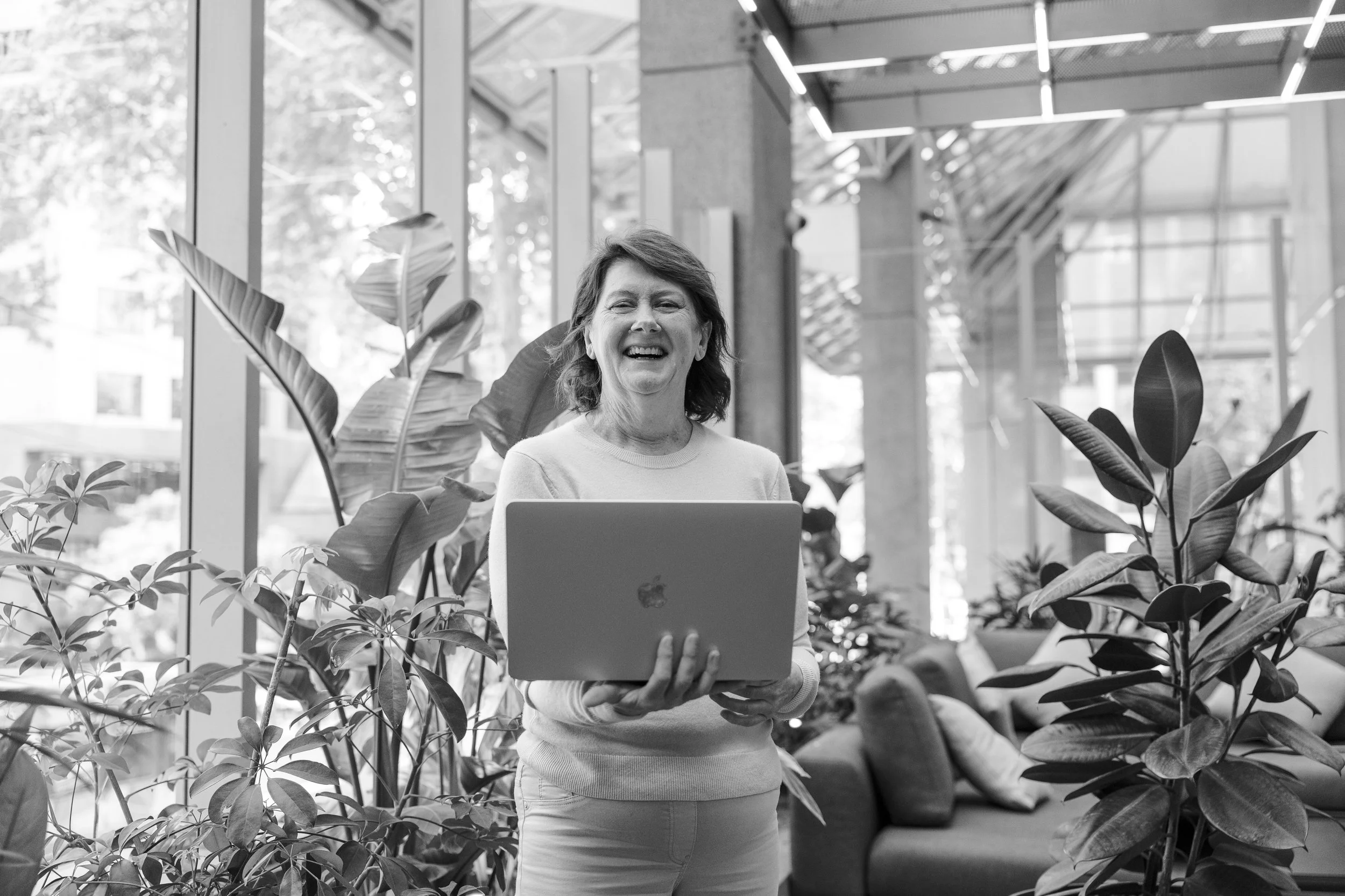 Danette Fenton-Menzies standing with laptop