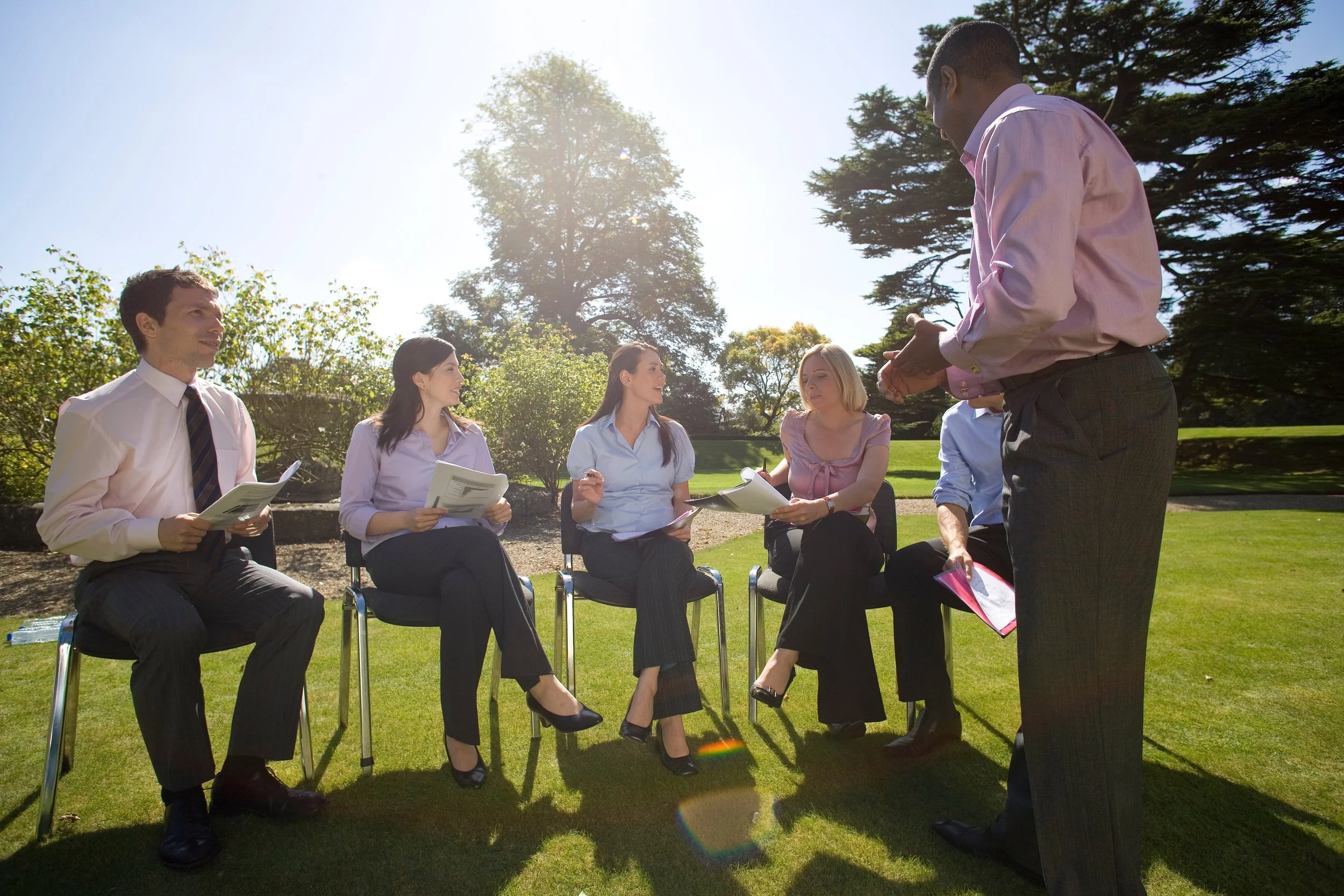 Professionals in strategy session at corporate retreat
