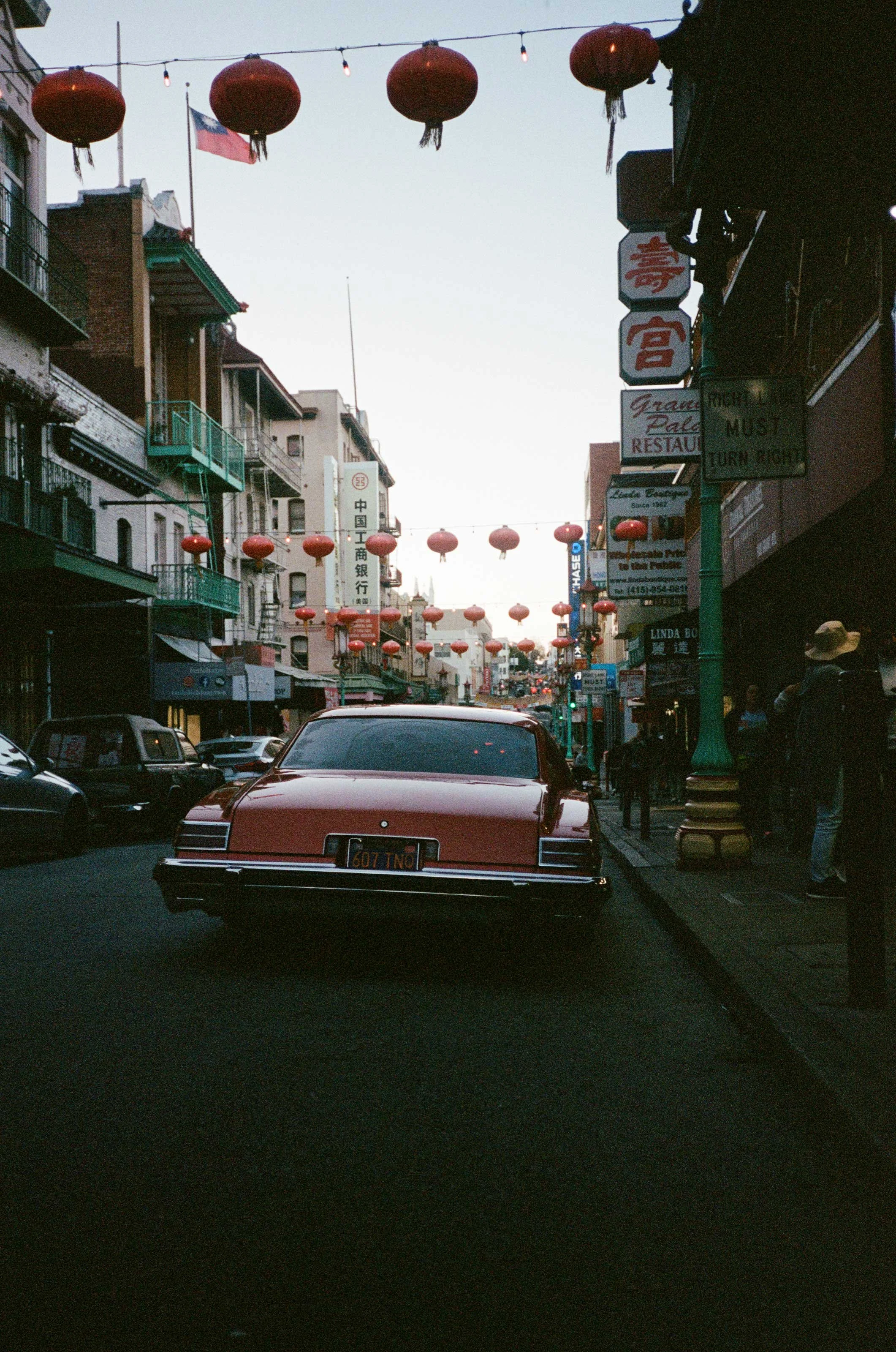 A photograph of a classic car in San Francisco China Town