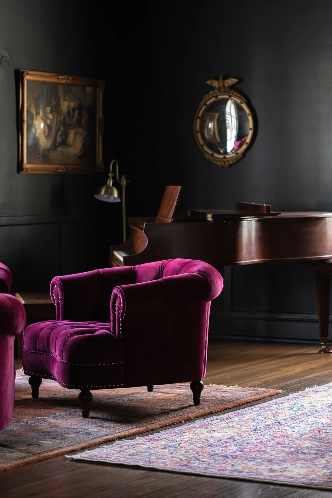 Carlisle's Restaurant Lounge in Hotel Everett | Boutique Hotel in Winnsboro, SC, historic hotel | Elegant room with dark walls and a wooden grand piano.