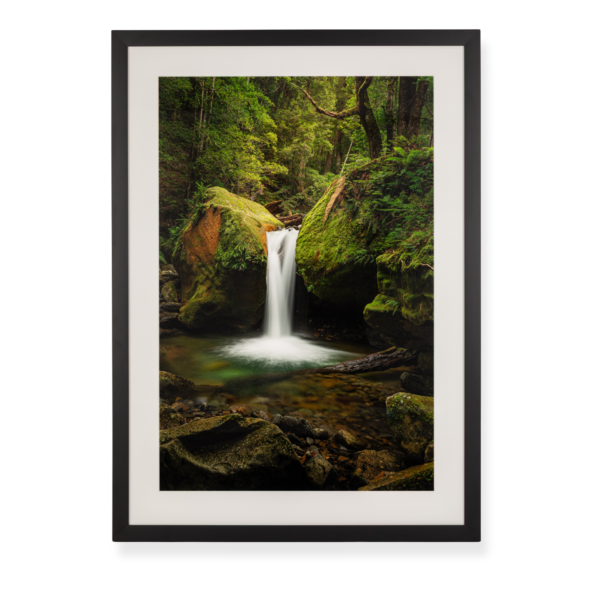 Framed Tasmania forest landscape photograph featuring a waterfall, moss-covered rocks, and lush greenery.