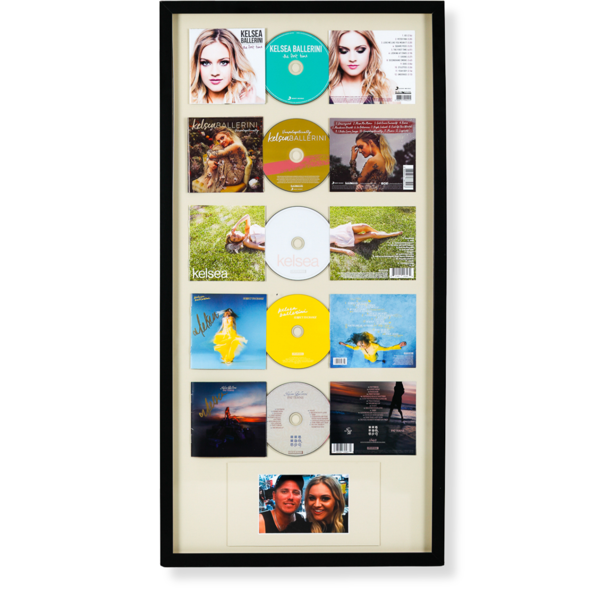 Custom framed CD and album cover collection featuring music memorabilia and personal photographs.