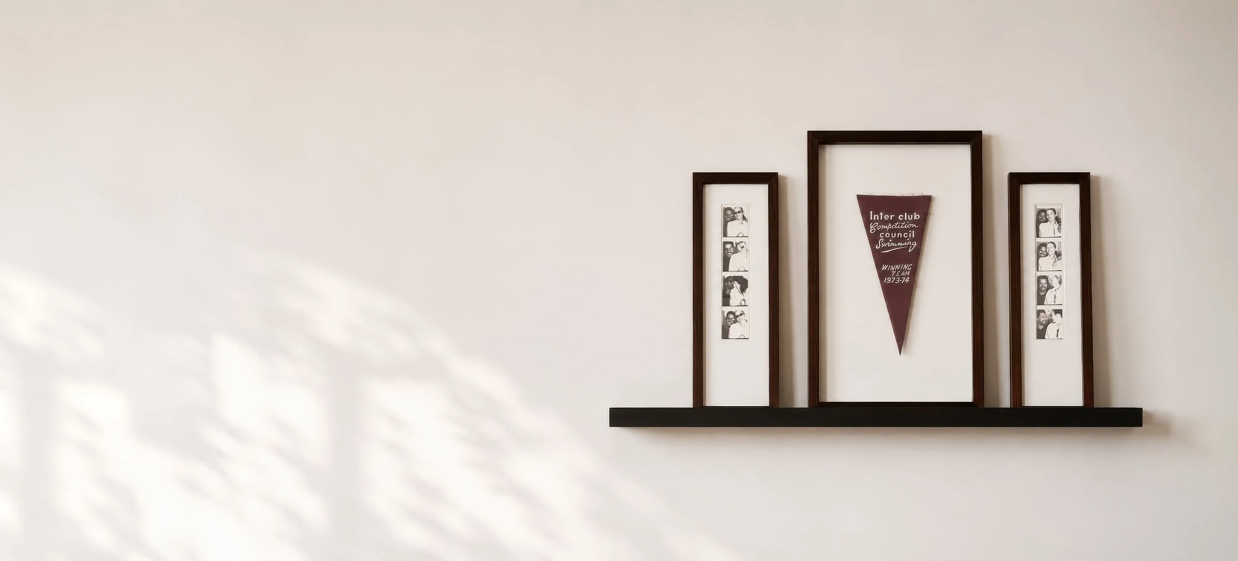 Custom framed memorabilia and personal keepsakes displayed as professionally finished wall art.