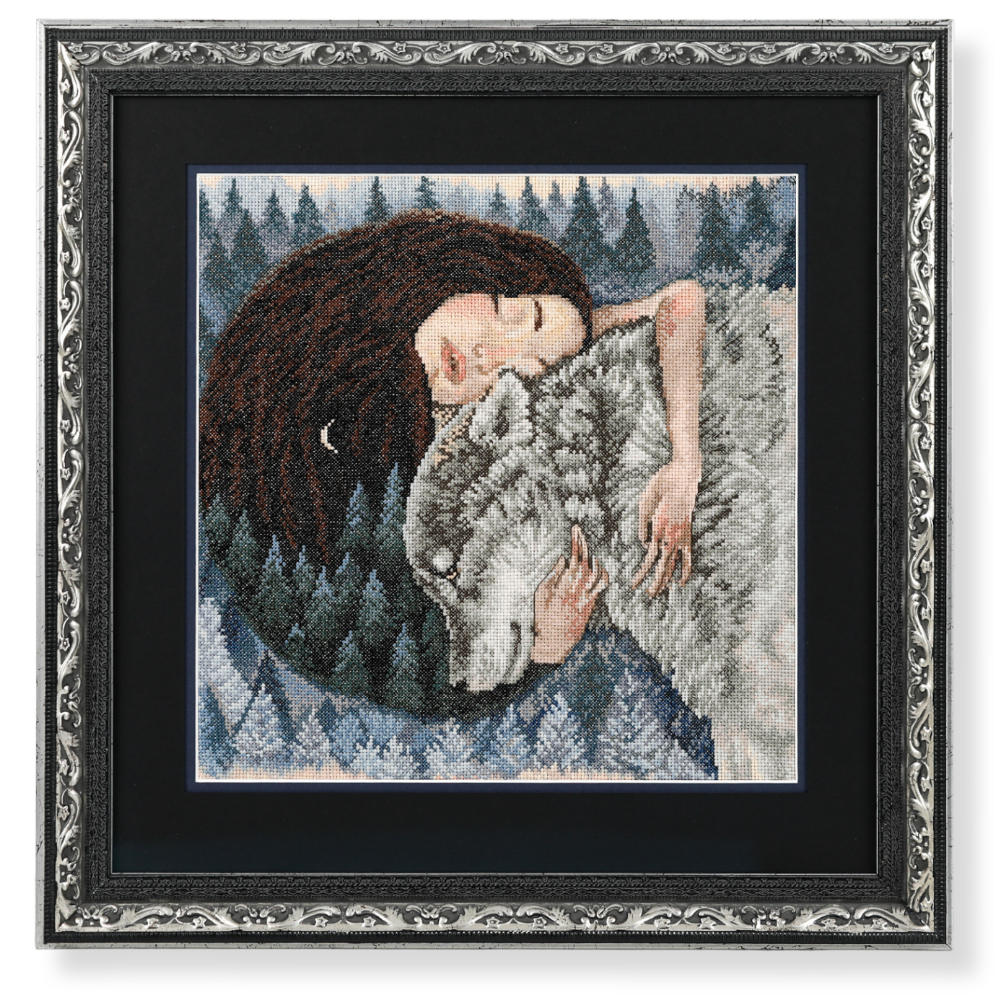 A framed cross-stitch embroidery girl and wolf artwork displayed in an ornate dark timber frame.