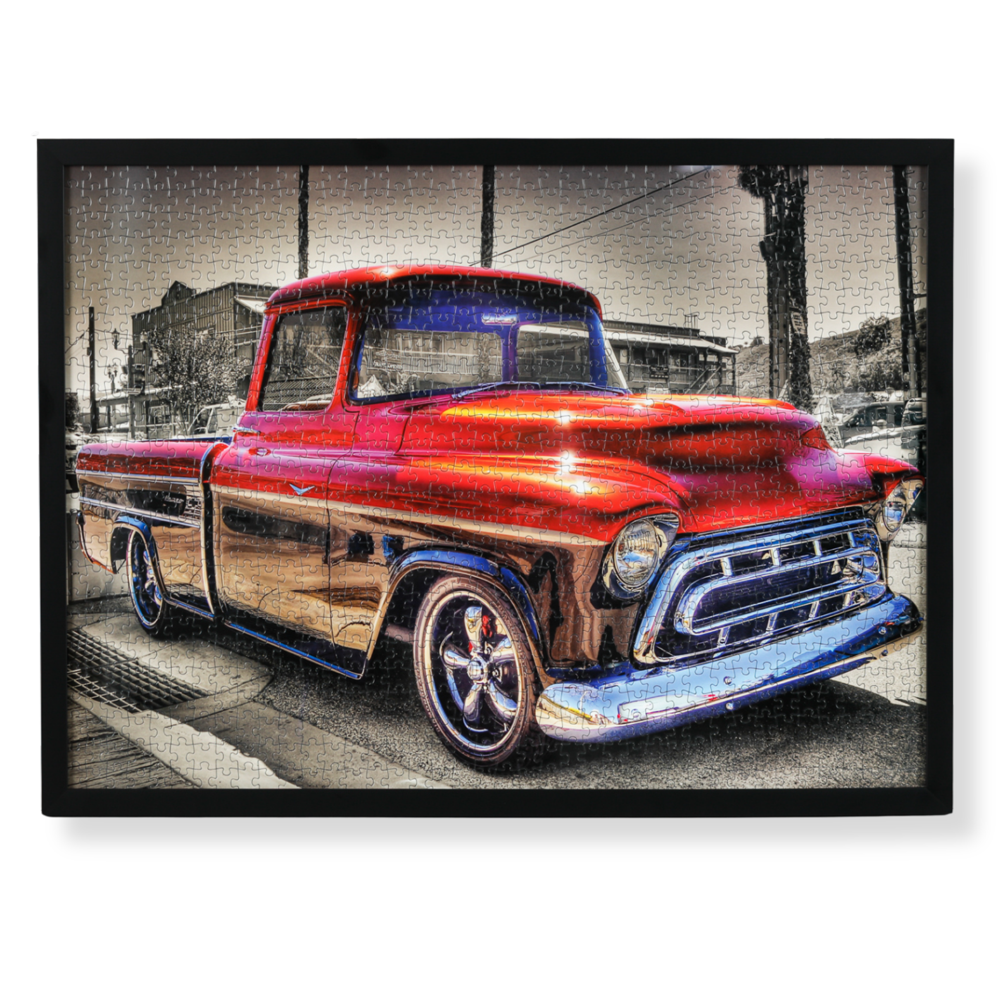 Custom framed vintage car jigsaw puzzle artwork, professionally restored with recreated missing piece, and displayed in a black frame. 