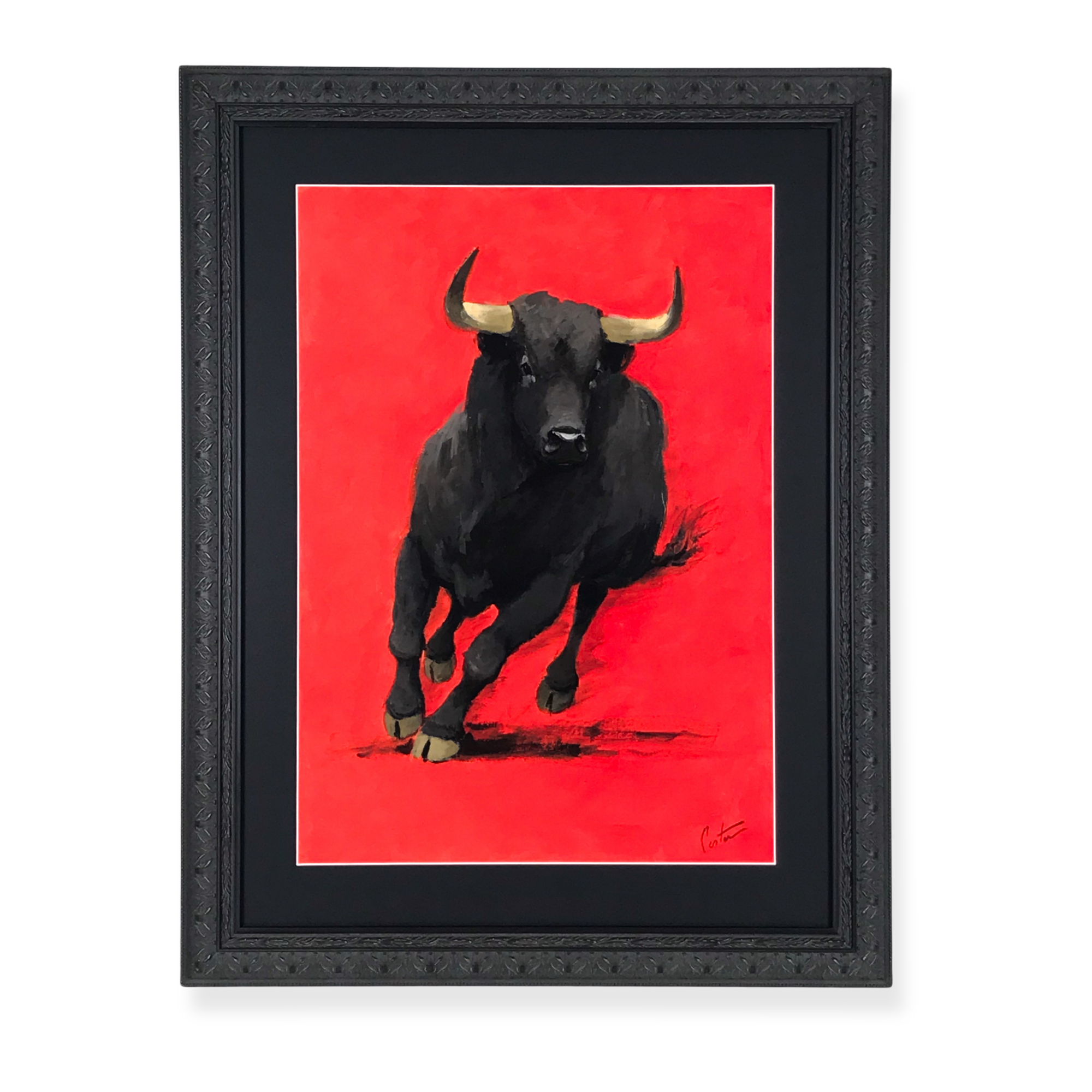Framed bull artwork displayed in an ornate black statement frame against a bold red background.