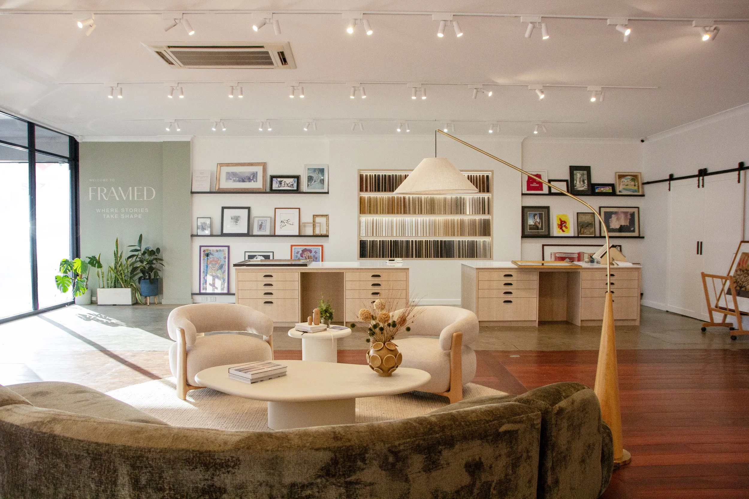 Modern custom framing consultation space at Framed featuring gallery-style framed artwork and a contemporary showroom experience.