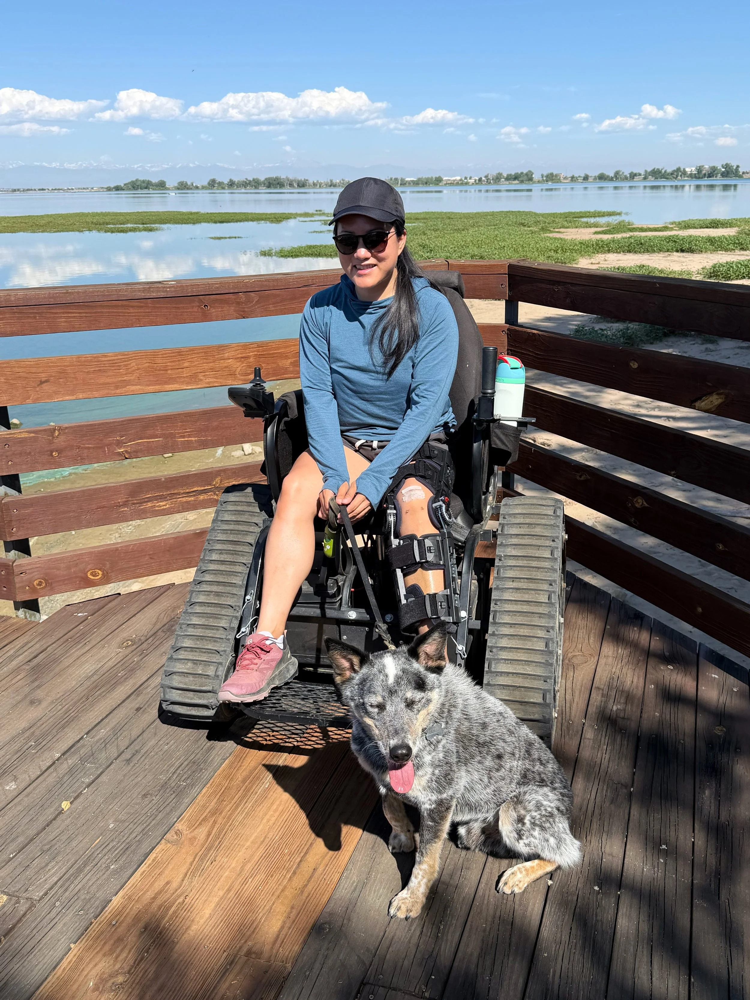 Woman using trackchair on boardwalk