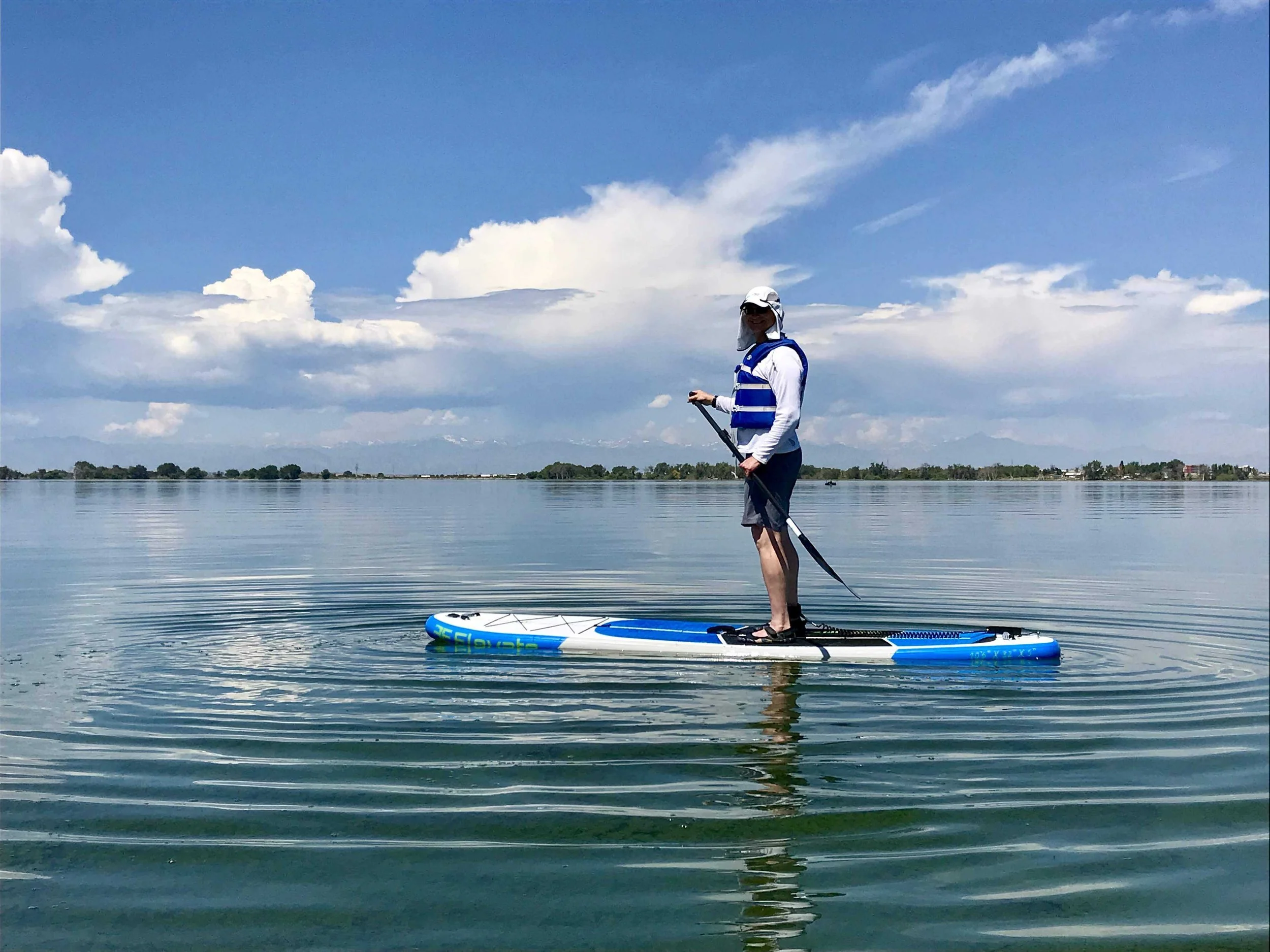 Man paddle boarding at Barr Lake State Park