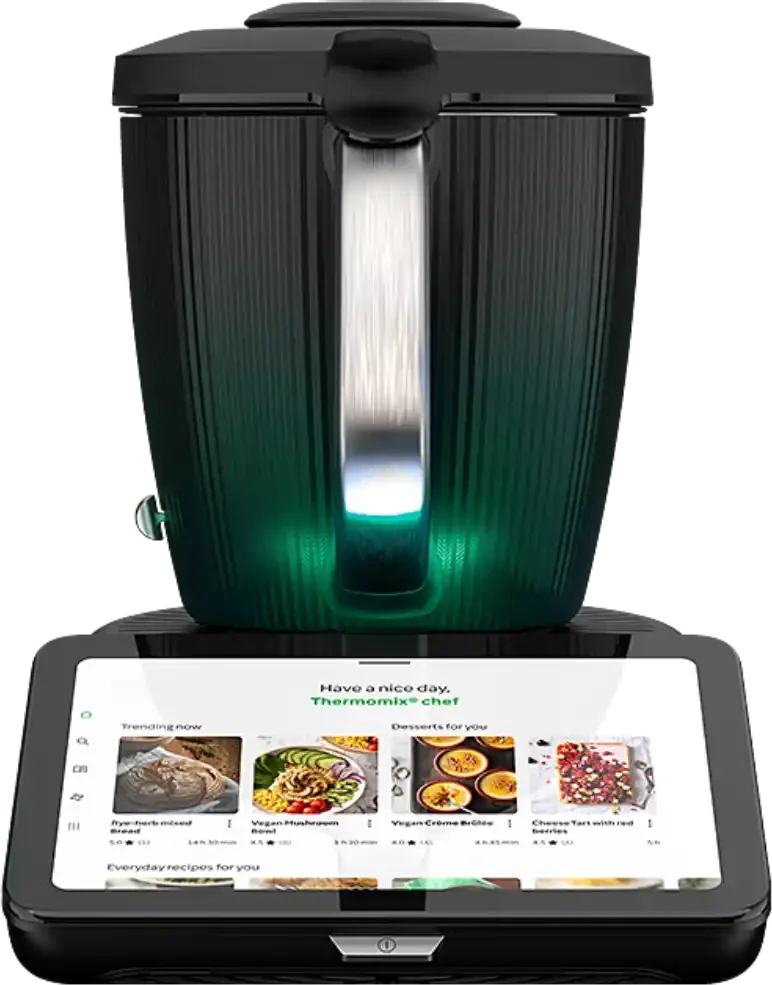A kitchen appliance with a built-in touchscreen displaying a recipe selection menu, with a sleek black and metallic design and a digital display underneath.