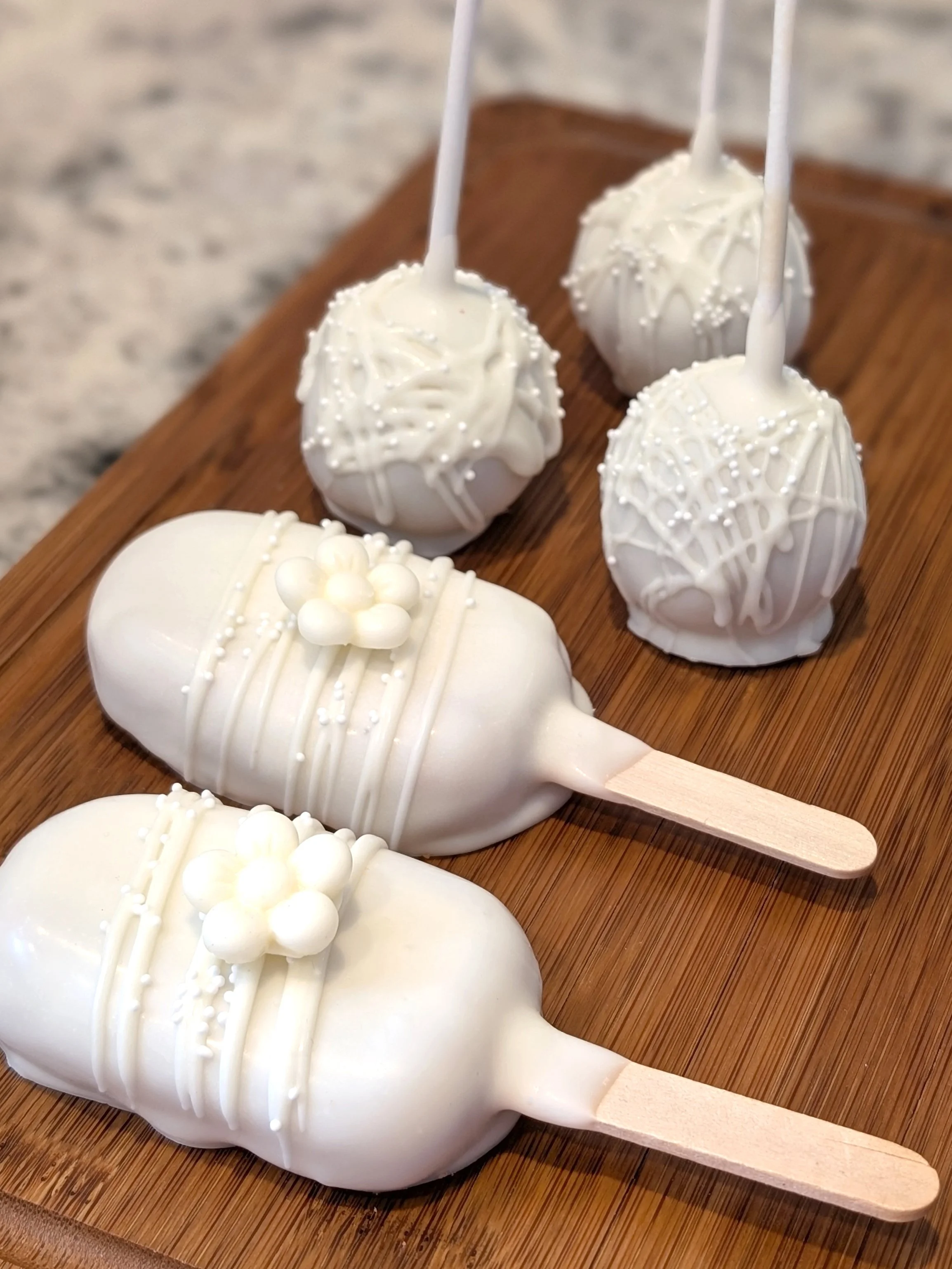 White cake pops with white decorations
