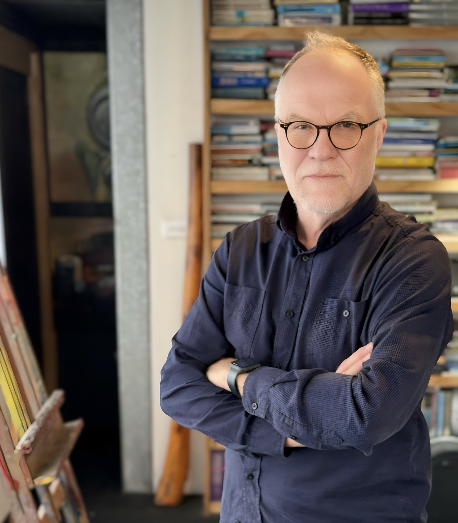 Photo of WJ de Kock, a man smiling, with glasses.