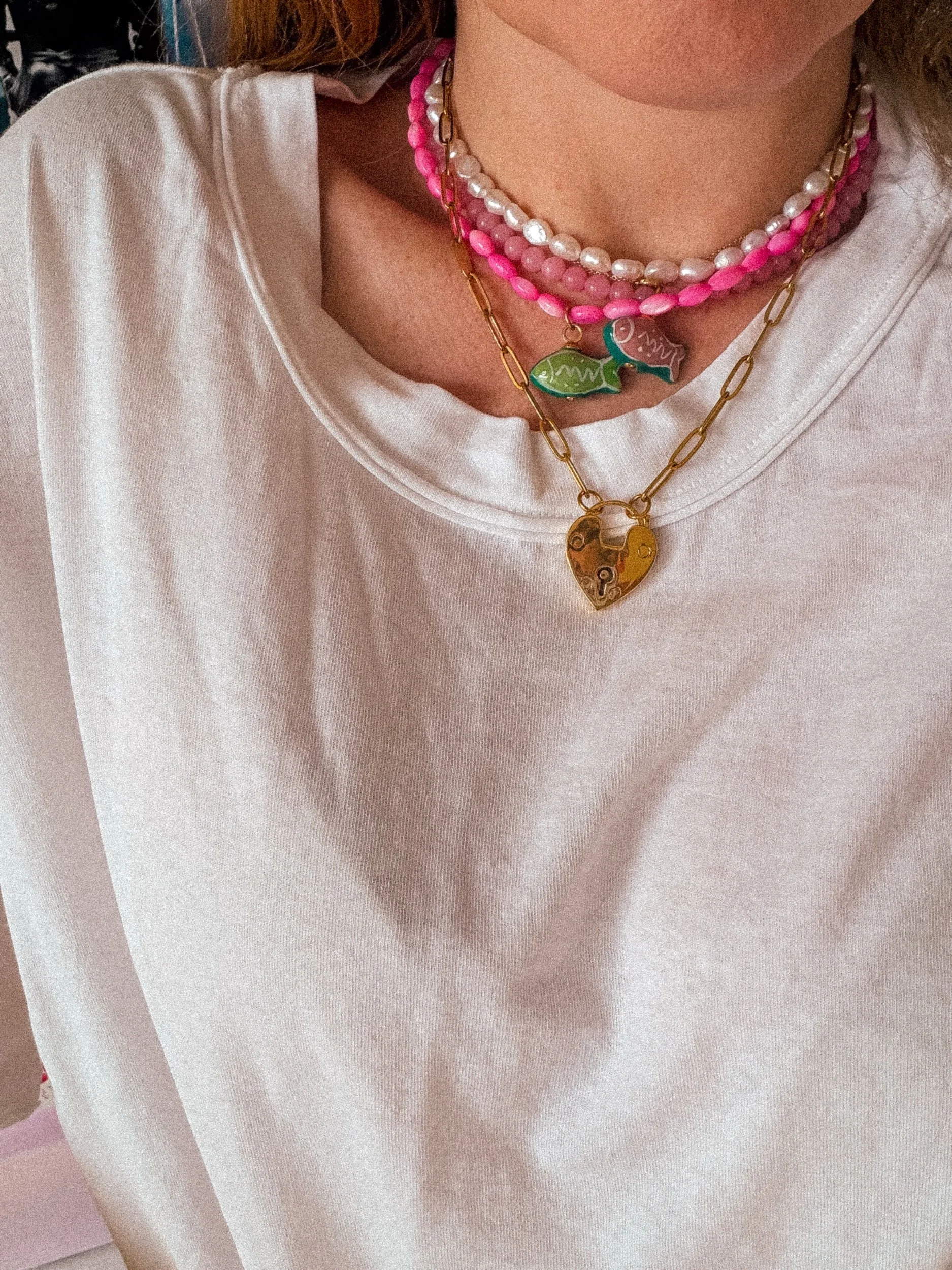 Close-up of Pink Crush Necklace fish charm detail