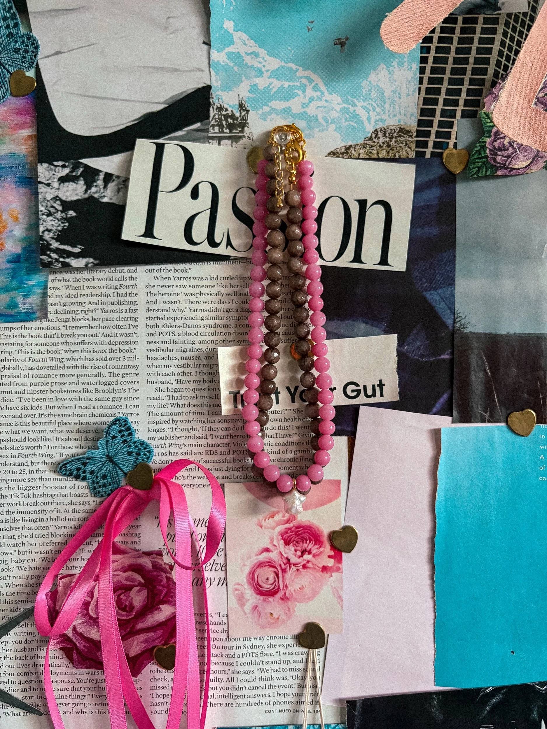 Handmade chestnut brown beaded necklace layered with a pink beaded necklace on a pink and blue collage with satin ribbons