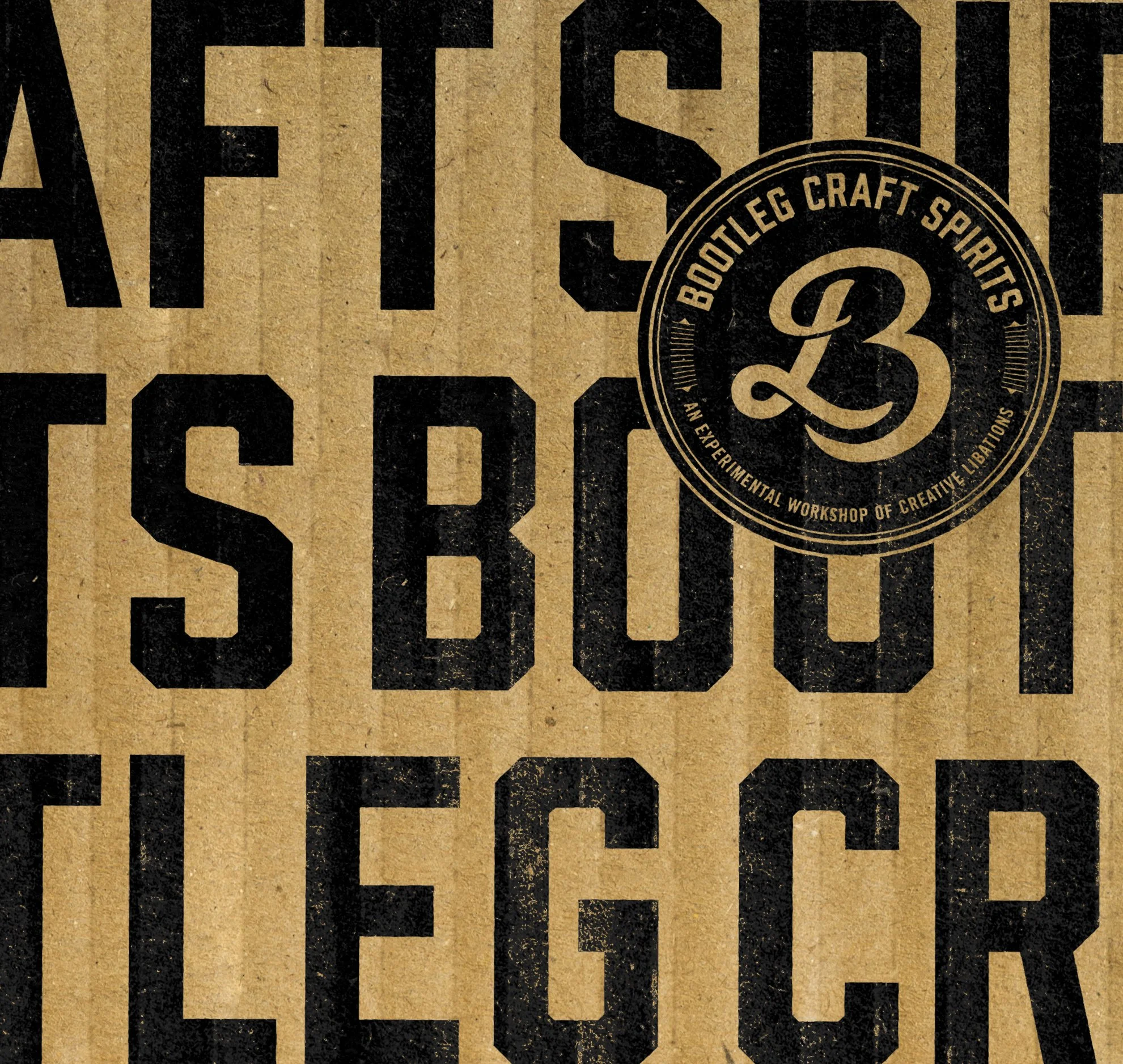 Close-up of a vintage cardboard box with black text and a circular logo reading 'Bootleg Craft Spirits' and '23' in the center.