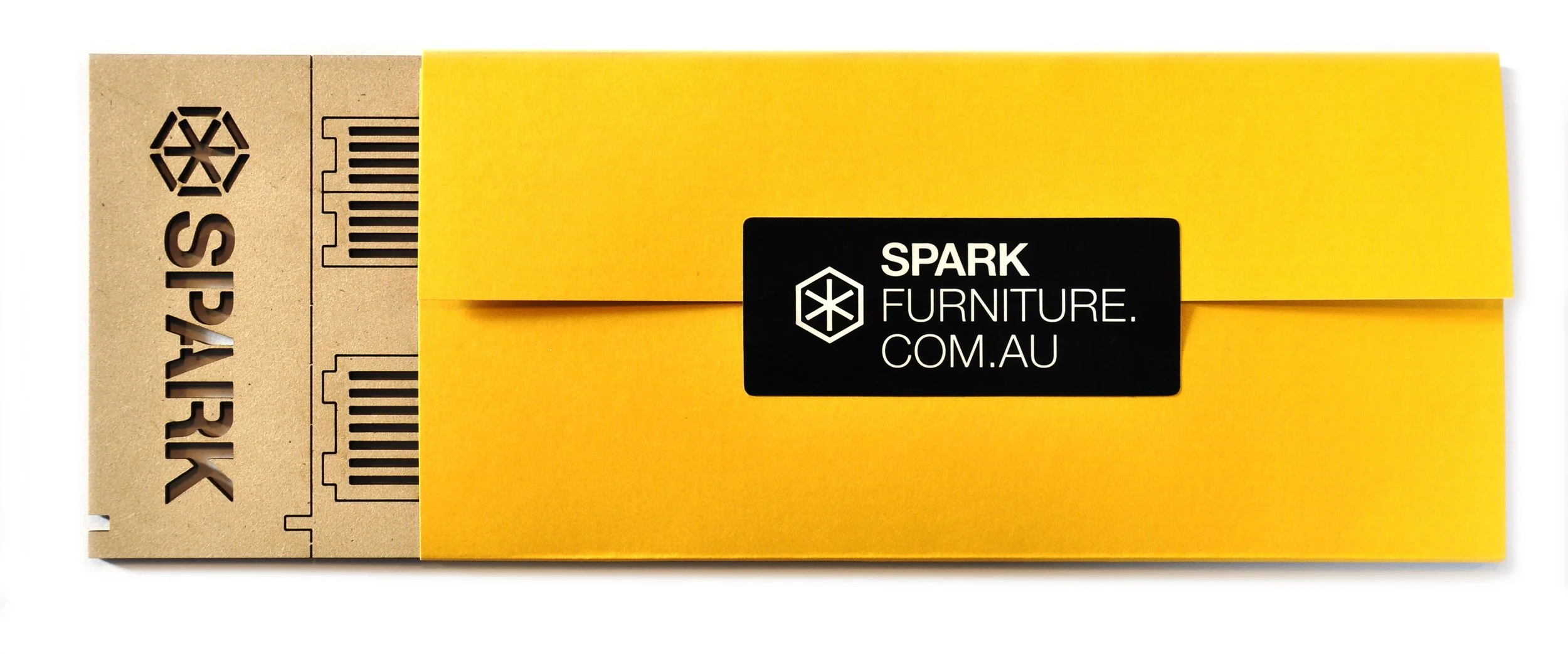 Yellow box of Spark Furniture branding with black label, and cardboard packaging with the brand name and barcode.