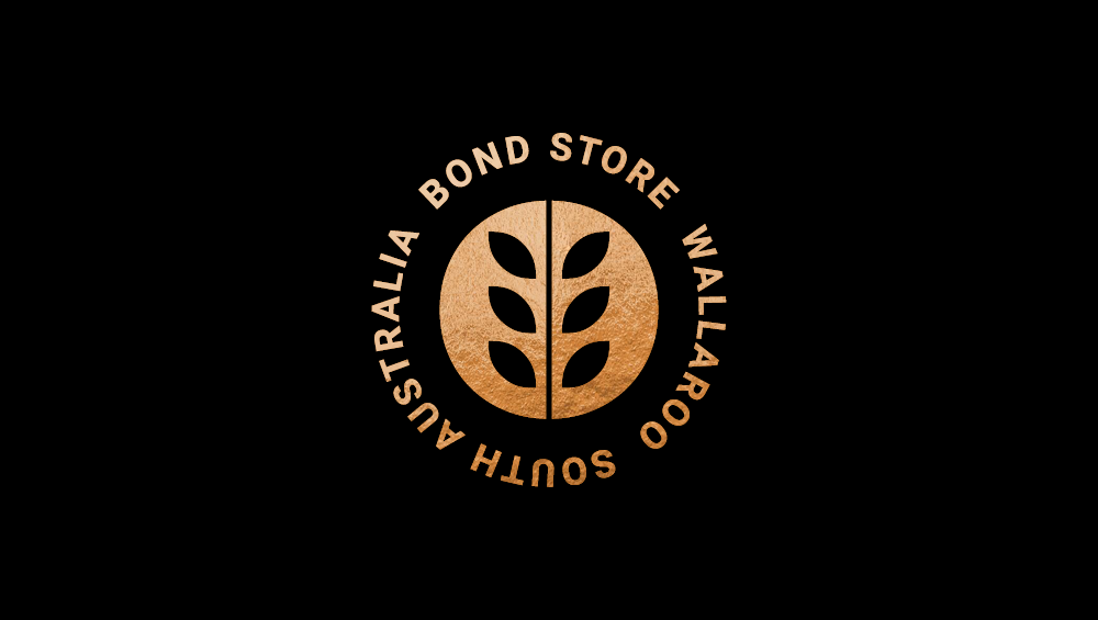 The logo for the South Australia Australia Bond Store Wallaroo, featuring a circular emblem with a stylized leaf design in the center and text around the circle.