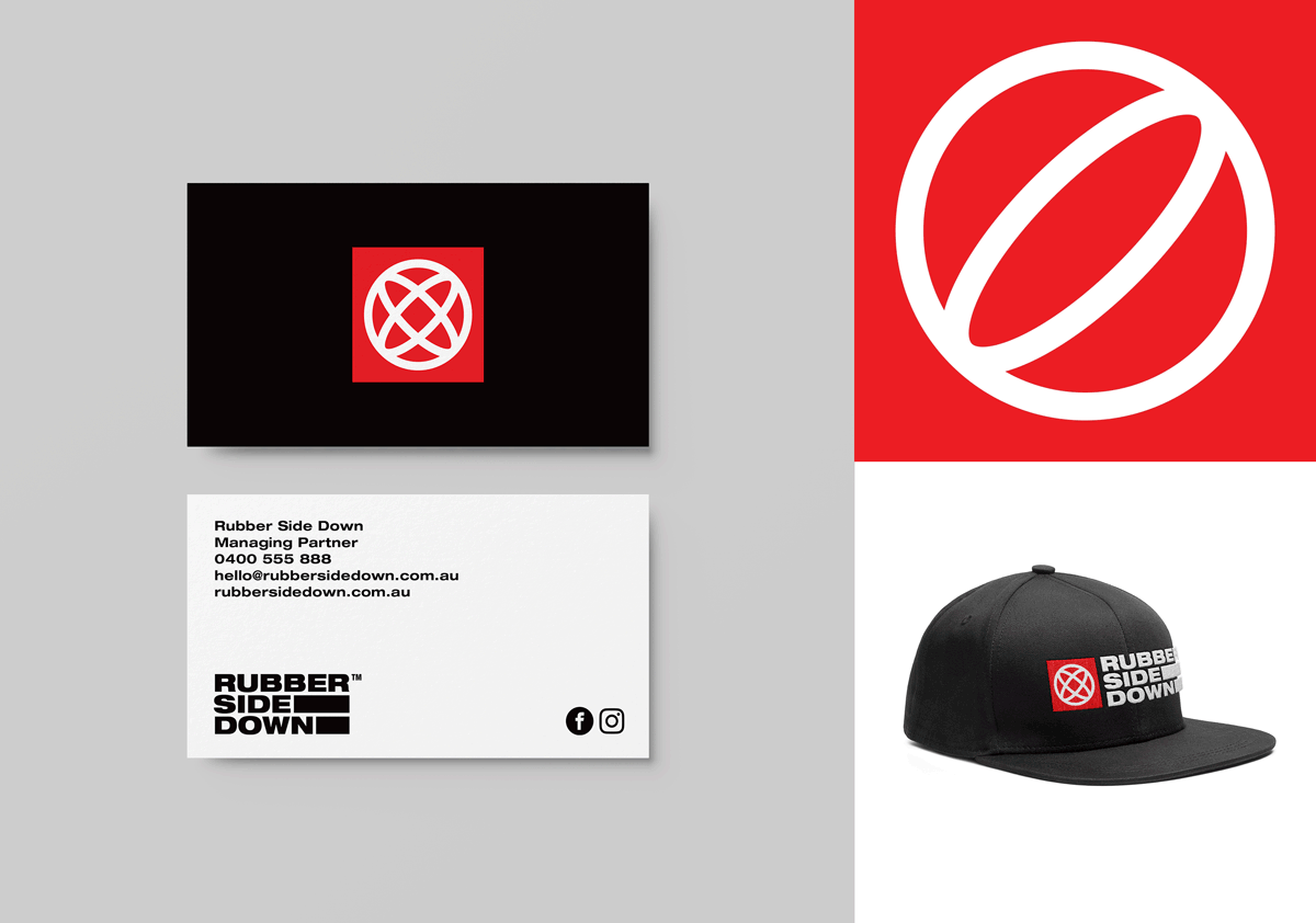Business card, cap, and square with a logo for Rubber Side Down, a company specializing in managing partners for rubber-related products. The logo features a white circle with a diagonal line inside, on a red background.