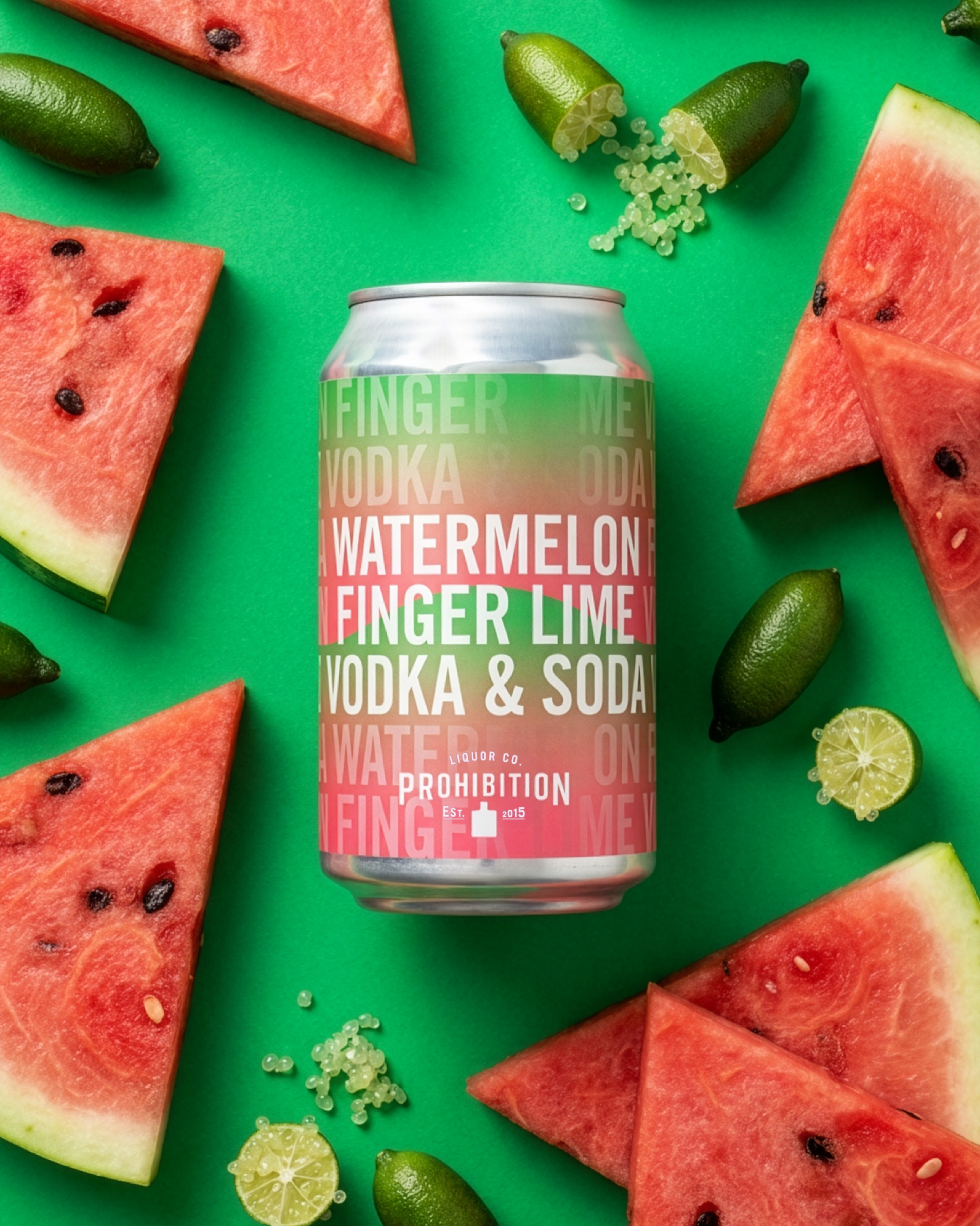 A can of Finger Liquor Co. vodka and soda on a bright green surface surrounded by sliced watermelon, lime, and small green limes, with green and yellow flavored gummy candies.