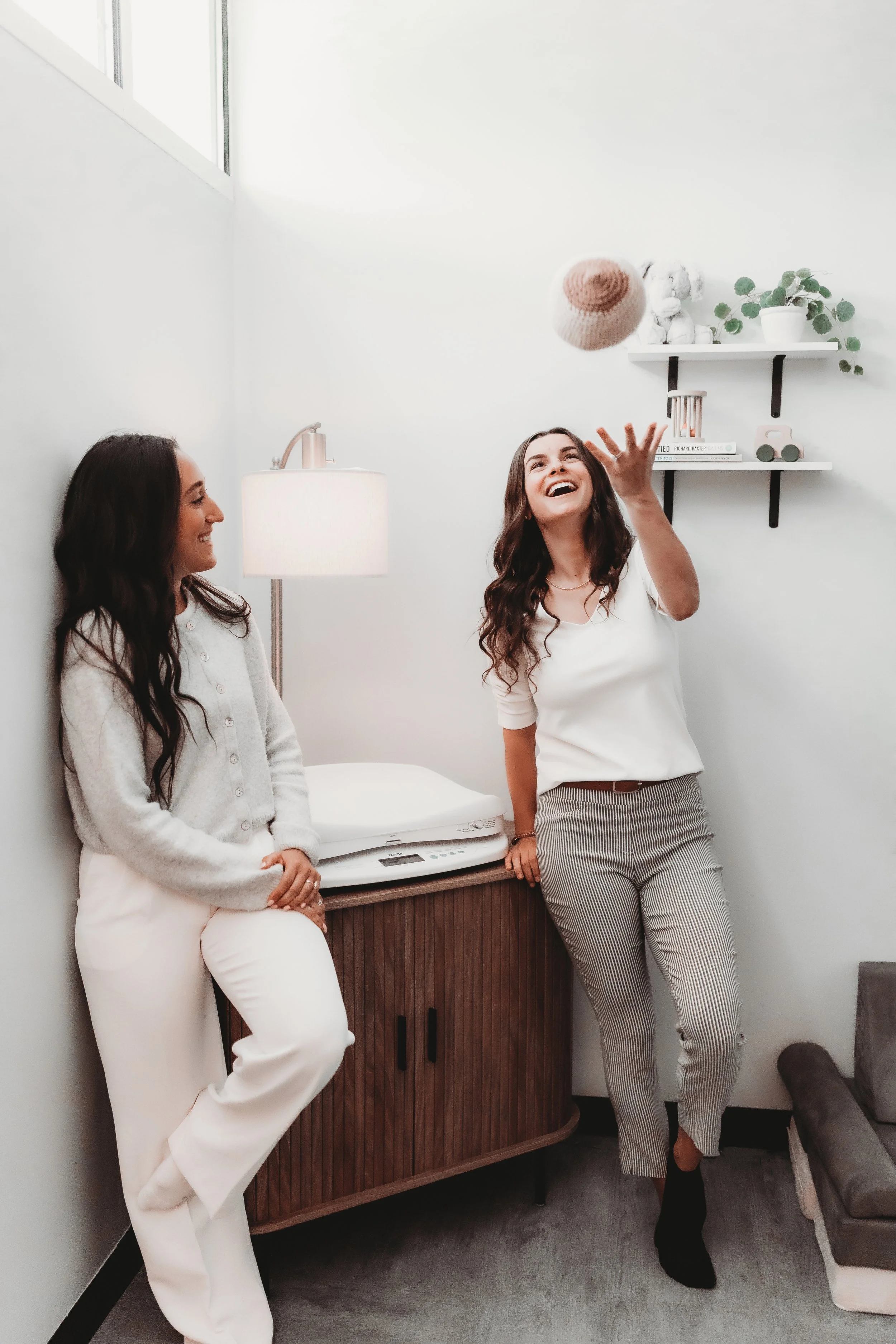 of Blue Door Holistic Therapy and Lactation laughing together in their New Port Richey Florida clinic