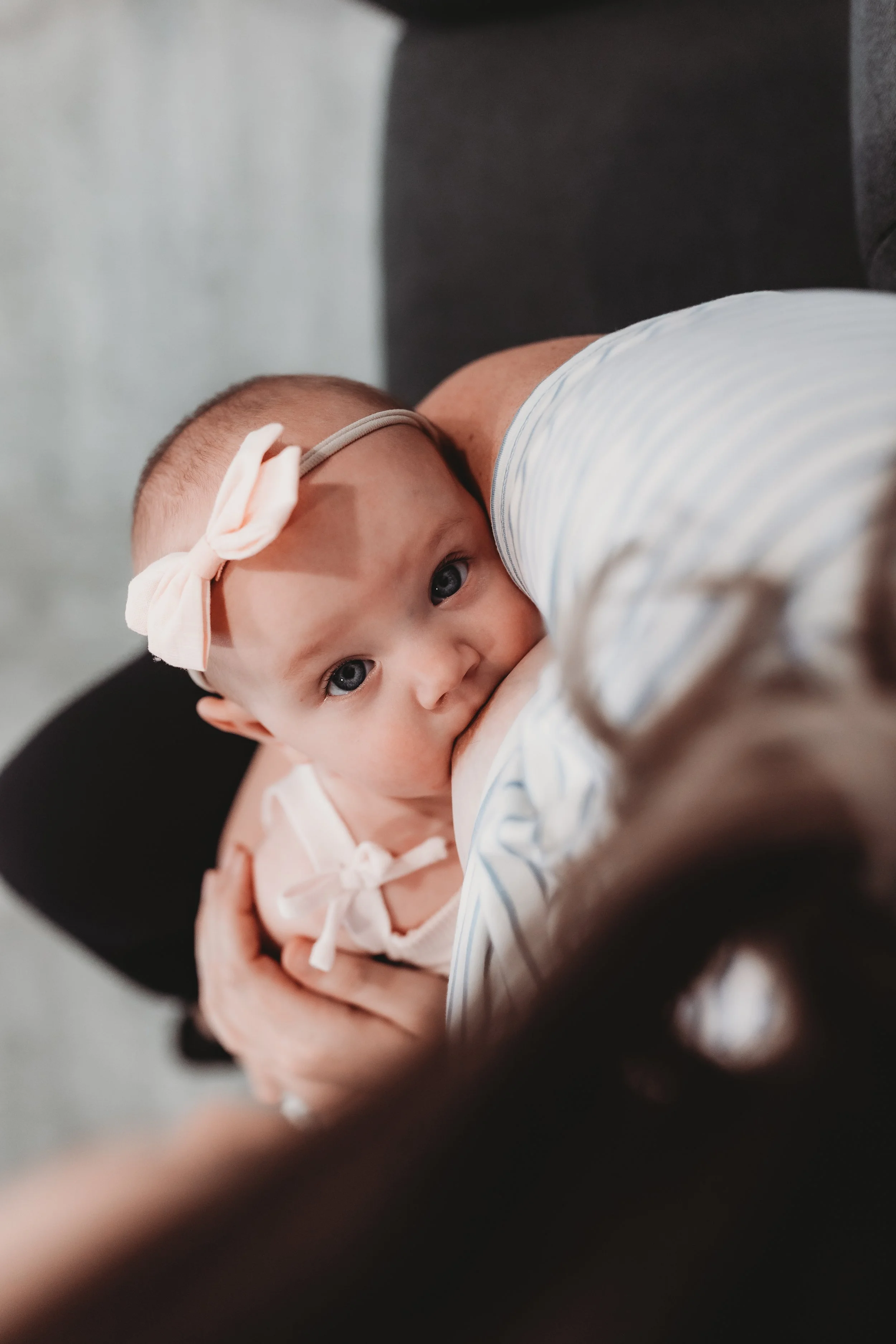 Infant breastfeeding during lactation consultation with IBCLC at Blue Door Holistic Therapy and Lactation in New Port Richey