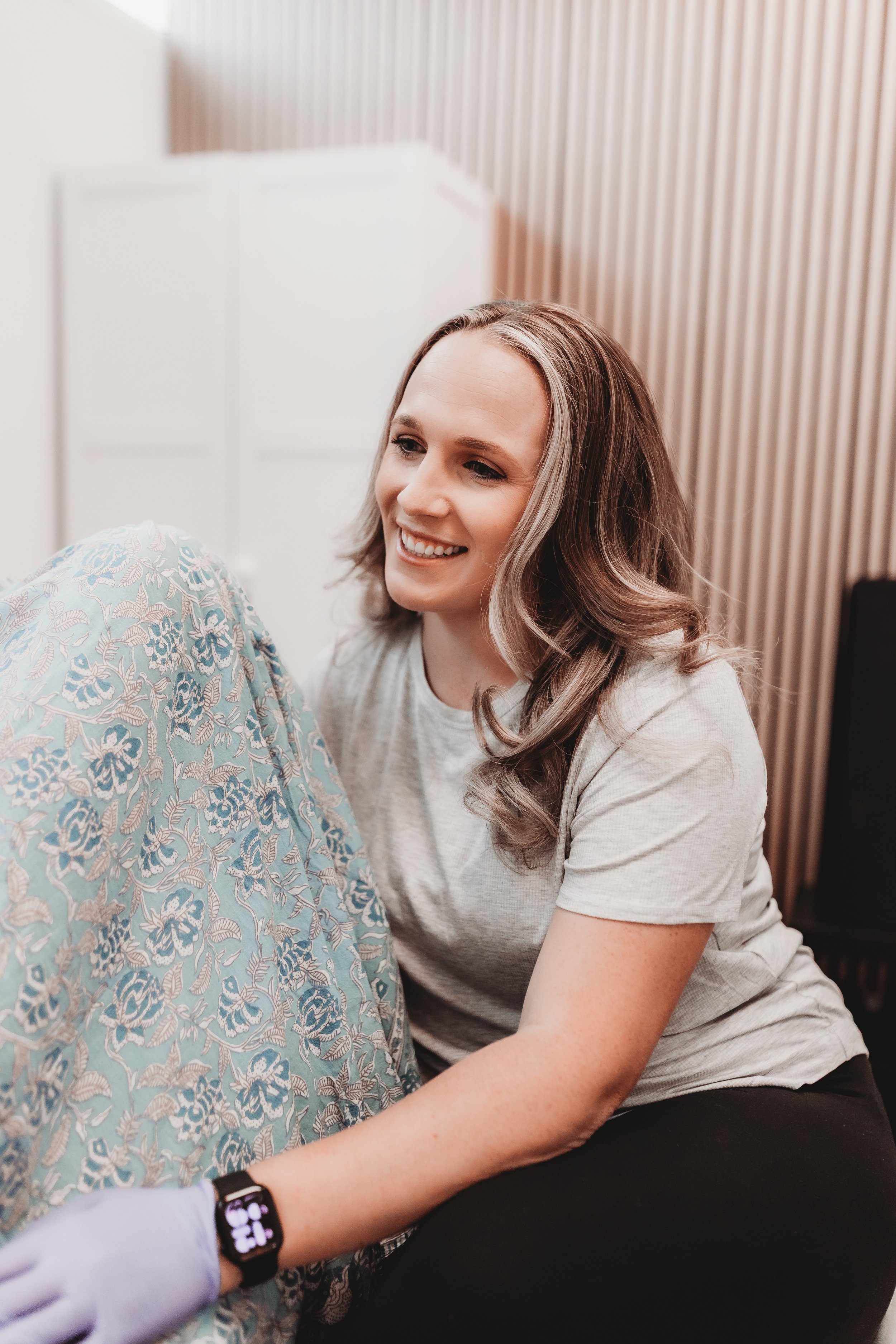 Women's pelvic health therapist smiling during treatment session at Blue Door Holistic Therapy and Lactation in New Port Richey Florida