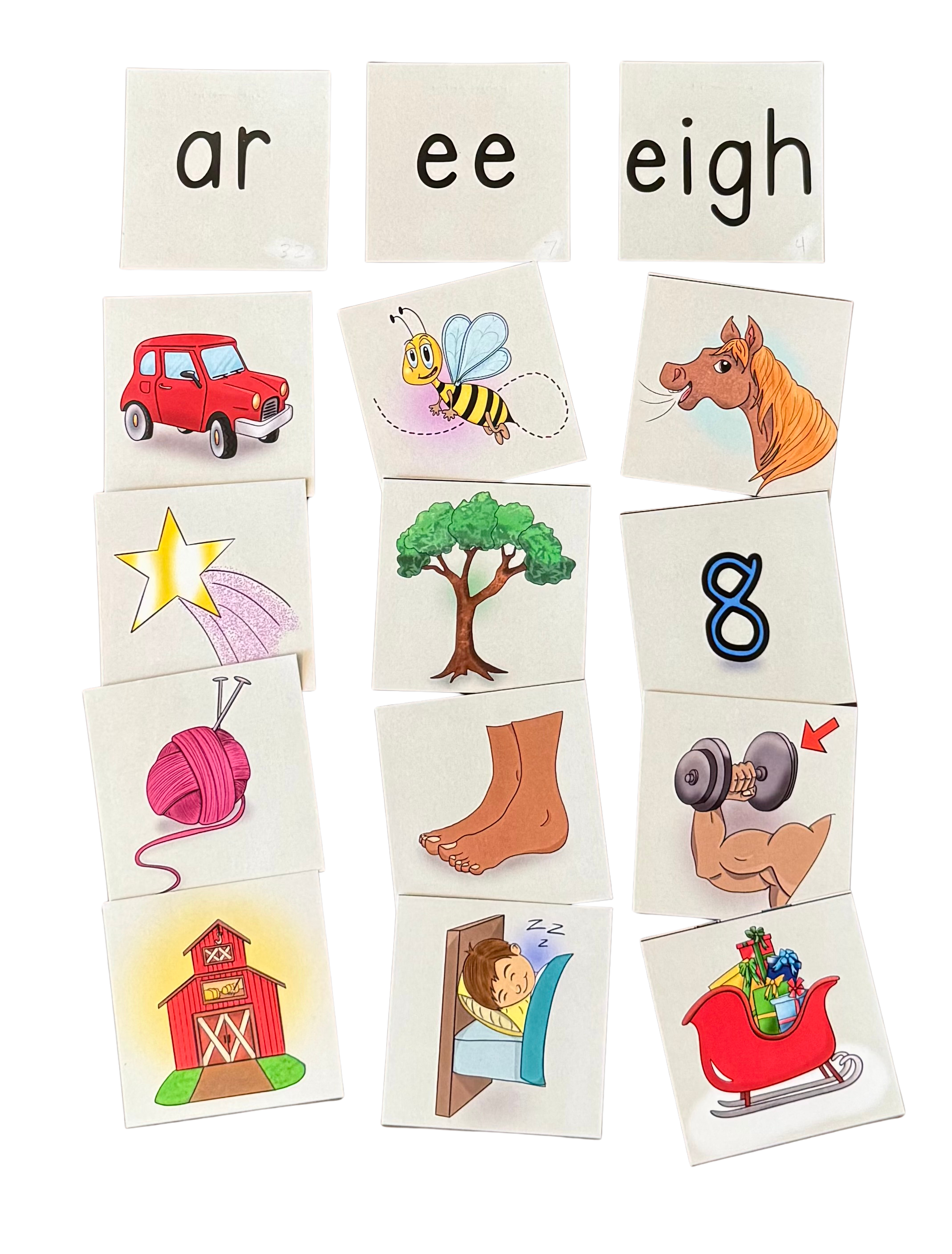 Flashcards with pictures and words, including a red car, a bee, a horse, a star, a tree, a barn, a sleeping child, a sleigh filled with presents, and the numbers 8 and 9, along with the words 'ar,' 'ee,' and 'eigh' at the top.