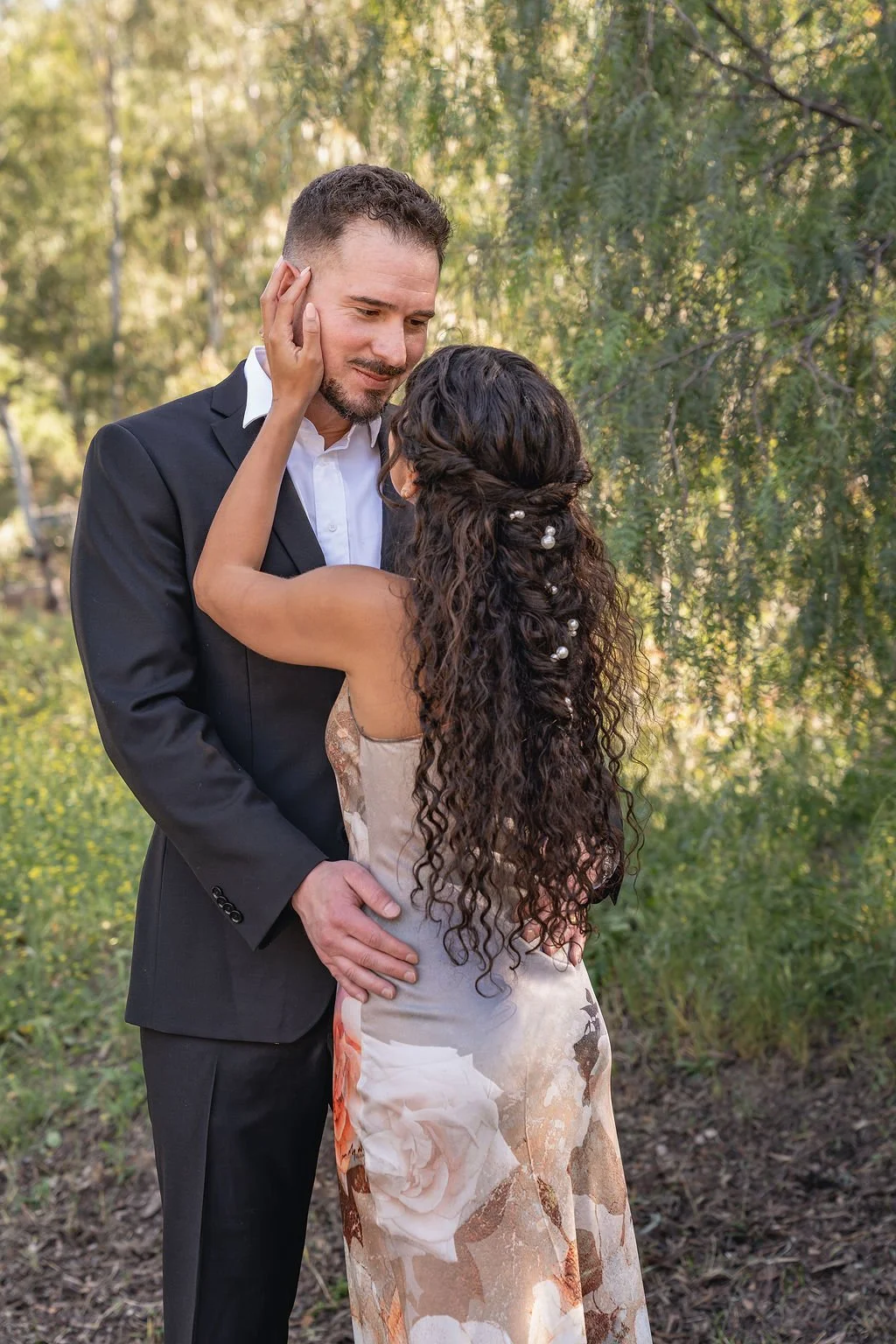 Wedding hair and makeup by Jazmin Uranga beauty featuring soft glam bridal makeup and boho braid on natural curls. Calamigos Ranch, Malibu