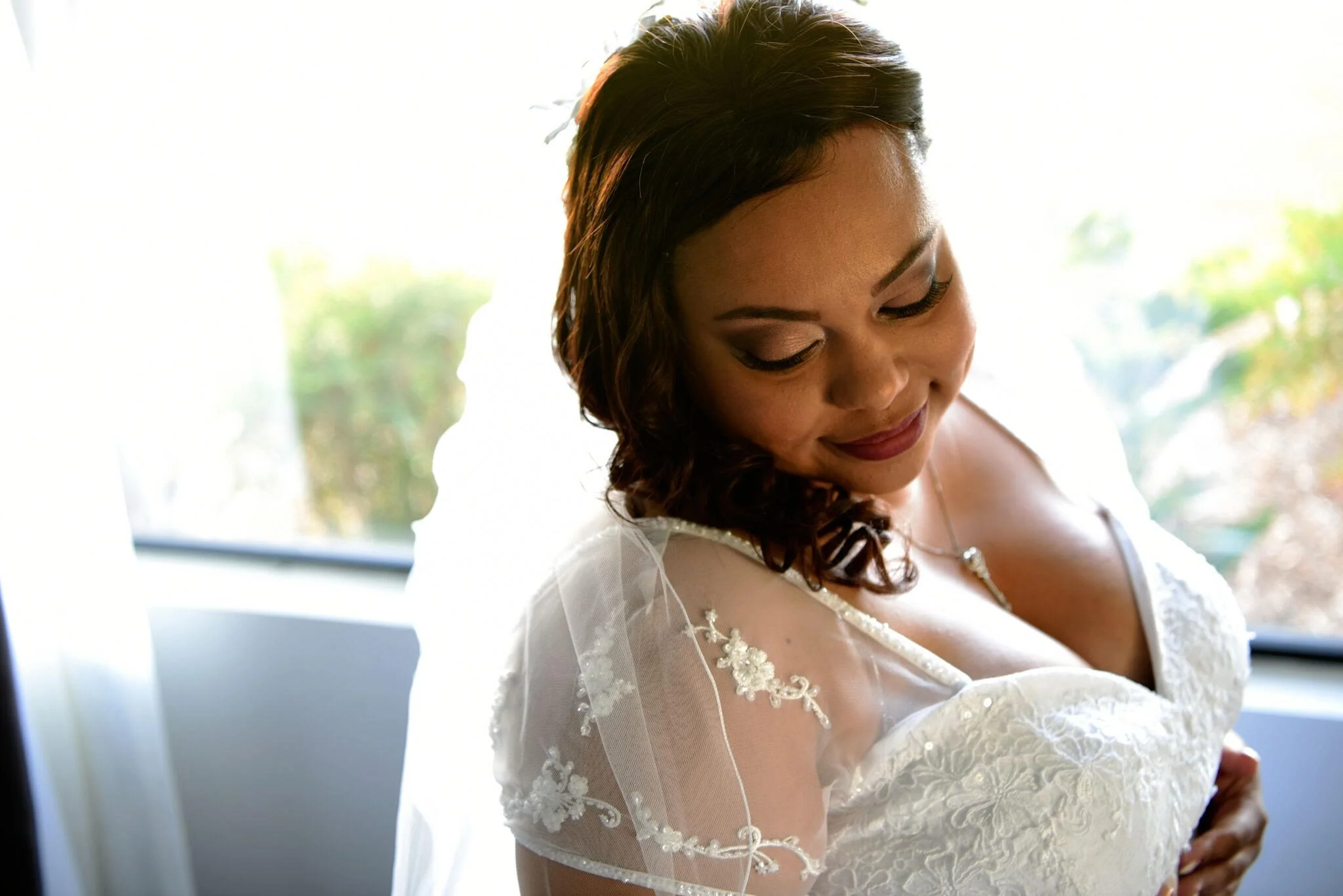 Bride with glowing soft glam makeup and soft waves during getting ready portraits at Gerry Ranch in Camarillo CA