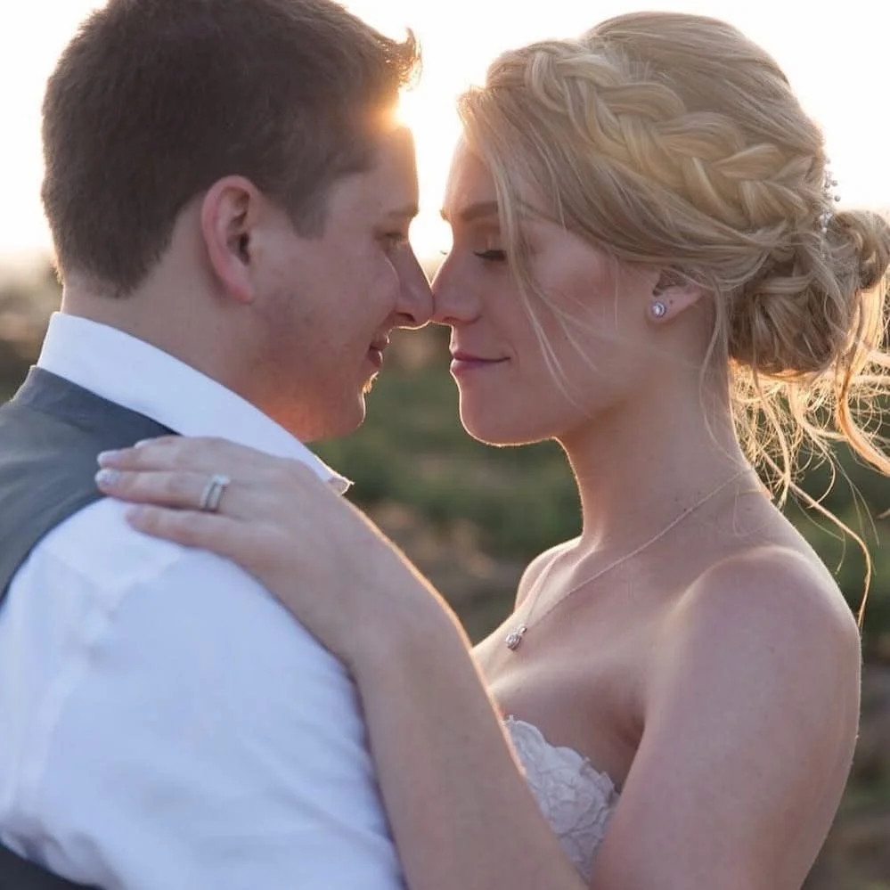 Bride with glowing soft glam makeup and timeless updo during sunset portraits at Gerry Ranch in Camarillo