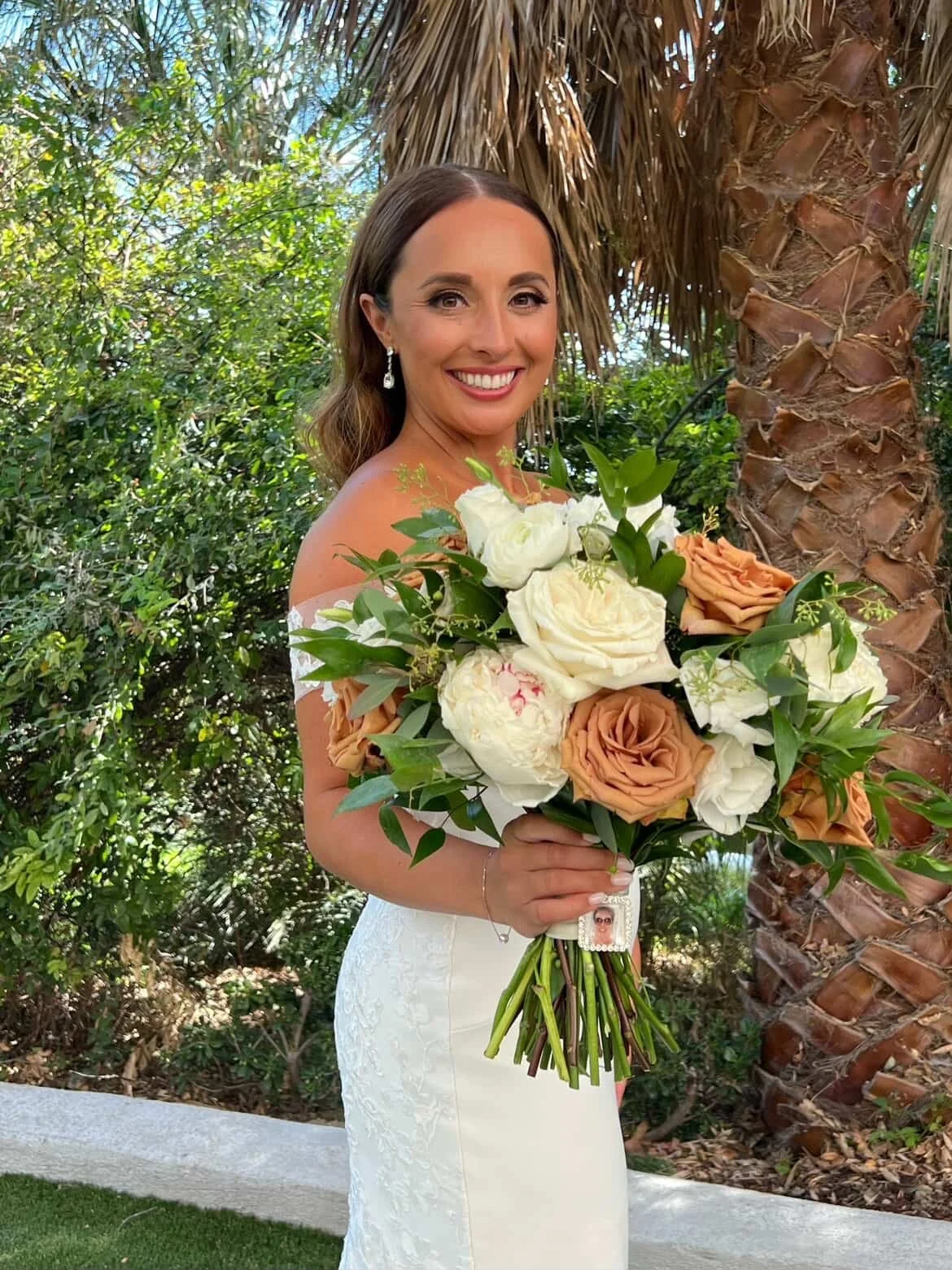Bridal portrait featuring soft glam makeup and polished glam waves hairstyle with bouquet at Spanish Hills Country Club in Camarillo. 