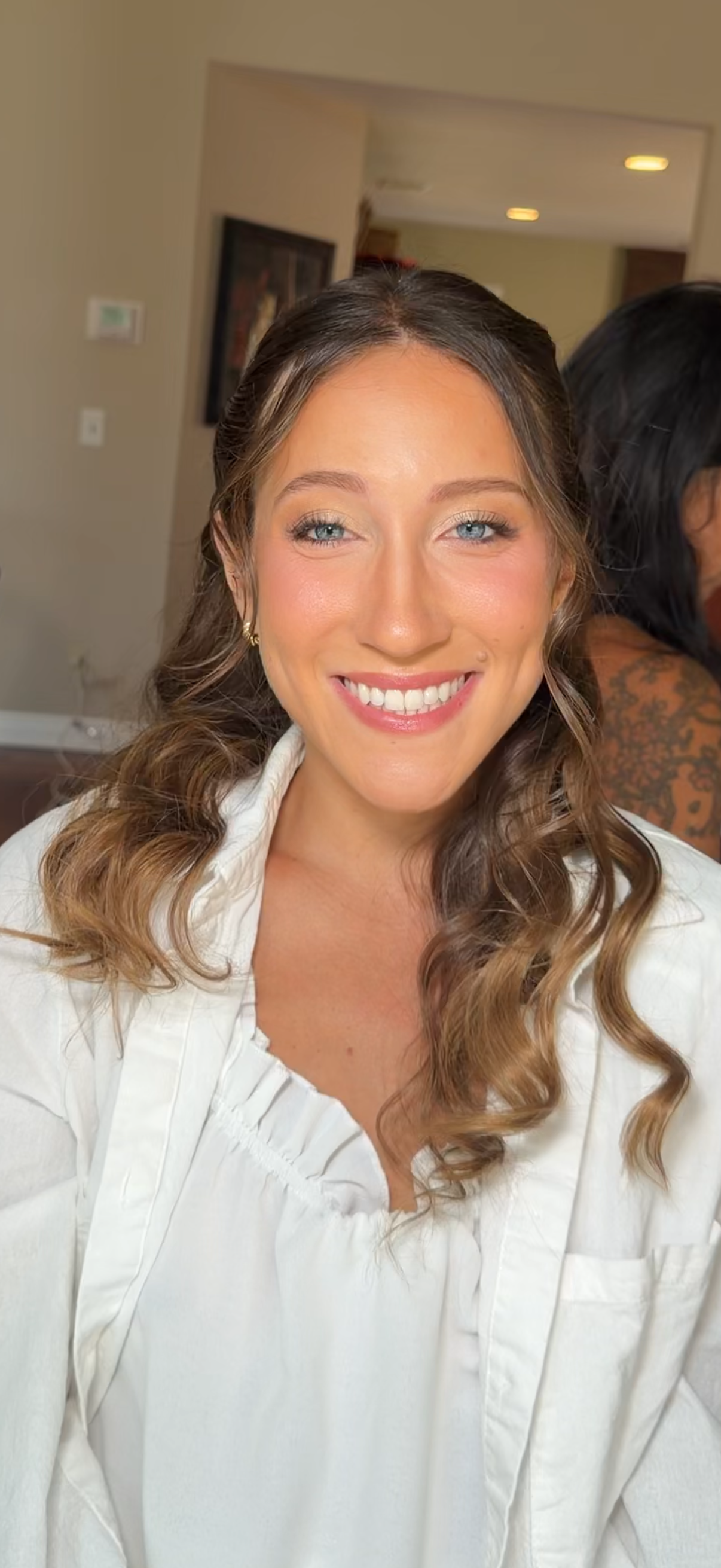 Bridal Makeup featuring soft glam eyes, radiant skin, defined lashes and a natural pink lip. Hair styled in loose curled waves with face-framing pieces for an elegant wedding-ready look in Thousand Oaks, CA