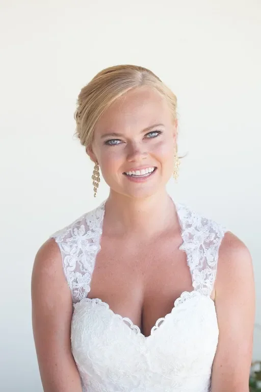 Bride portrait featuring soft glam makeup and classic updo at Zachari Dunes Mandalay Beach in Oxnard