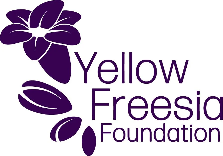 Purple flower and leaves graphic with the text 'Yellow Freesia Foundation'