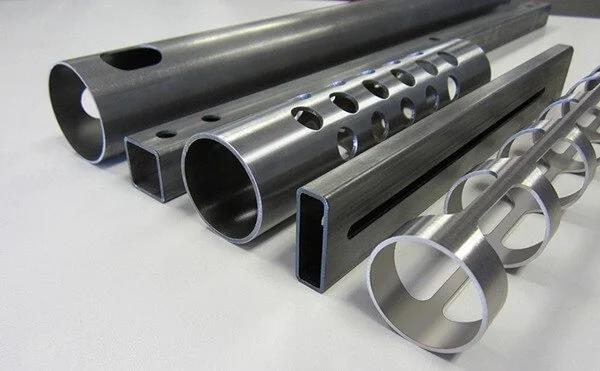 Perfectly coped saddle joint on round steel pipe fitting completely flush against another tube section.