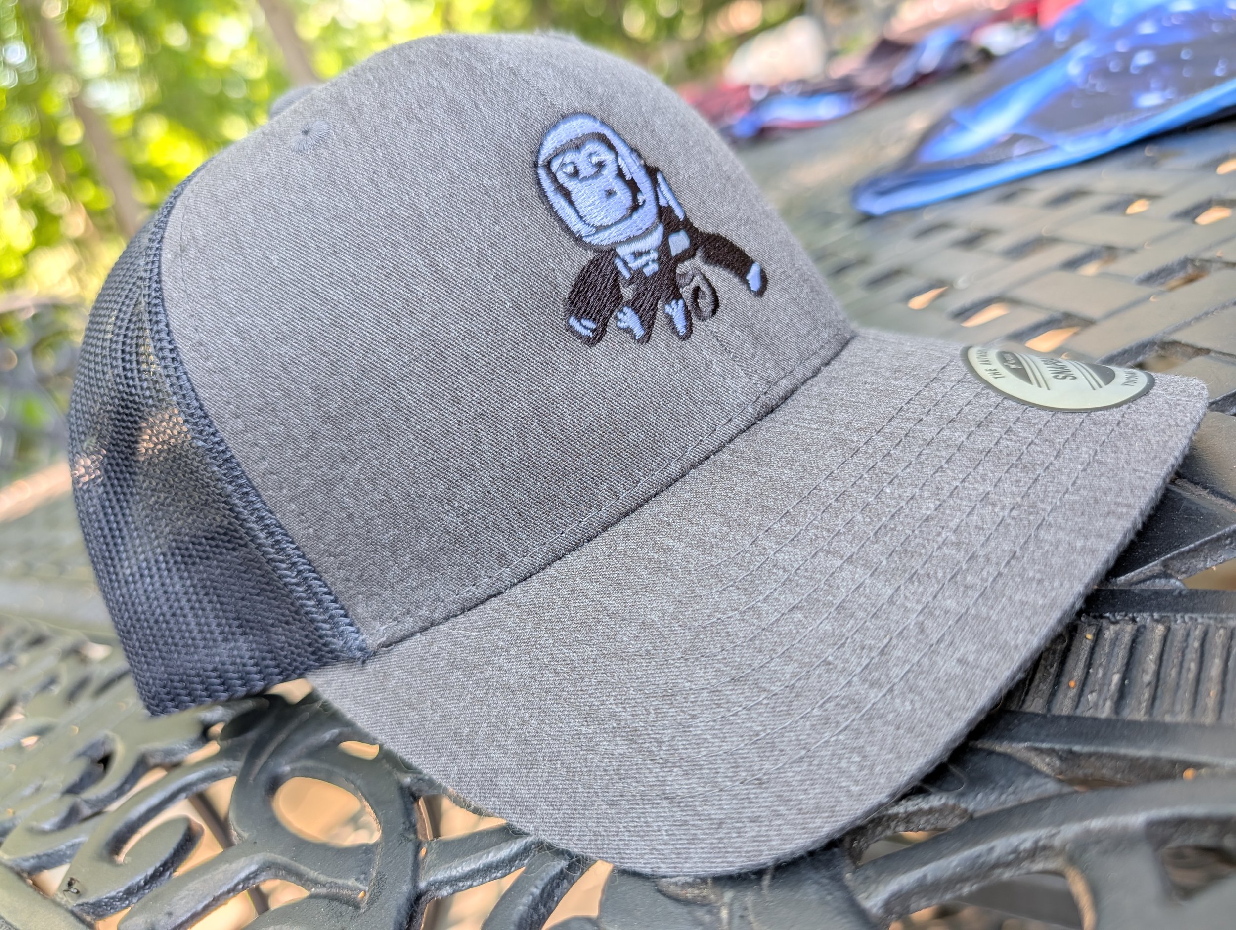 Embroidered High Space Man logo trucker hat with mesh back