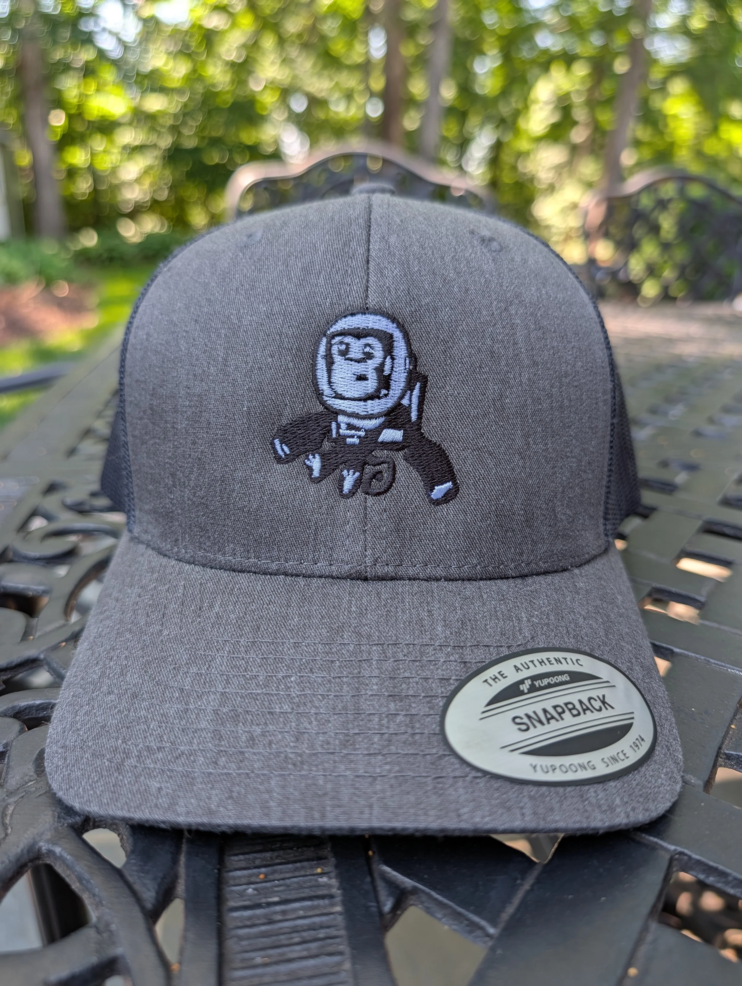 Embroidered High Space Man logo trucker hat with mesh back
