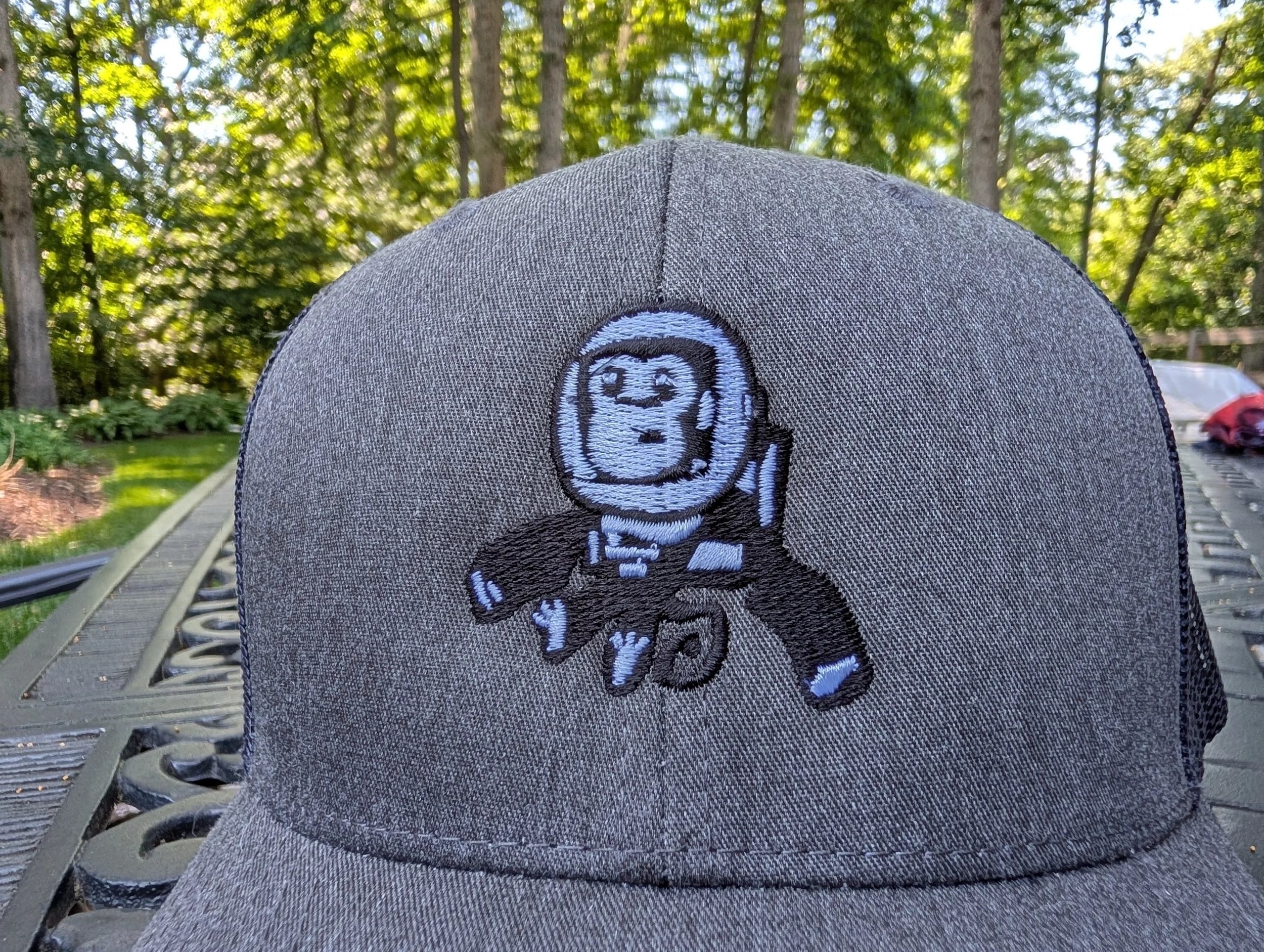 Embroidered High Space Man logo trucker hat with mesh back