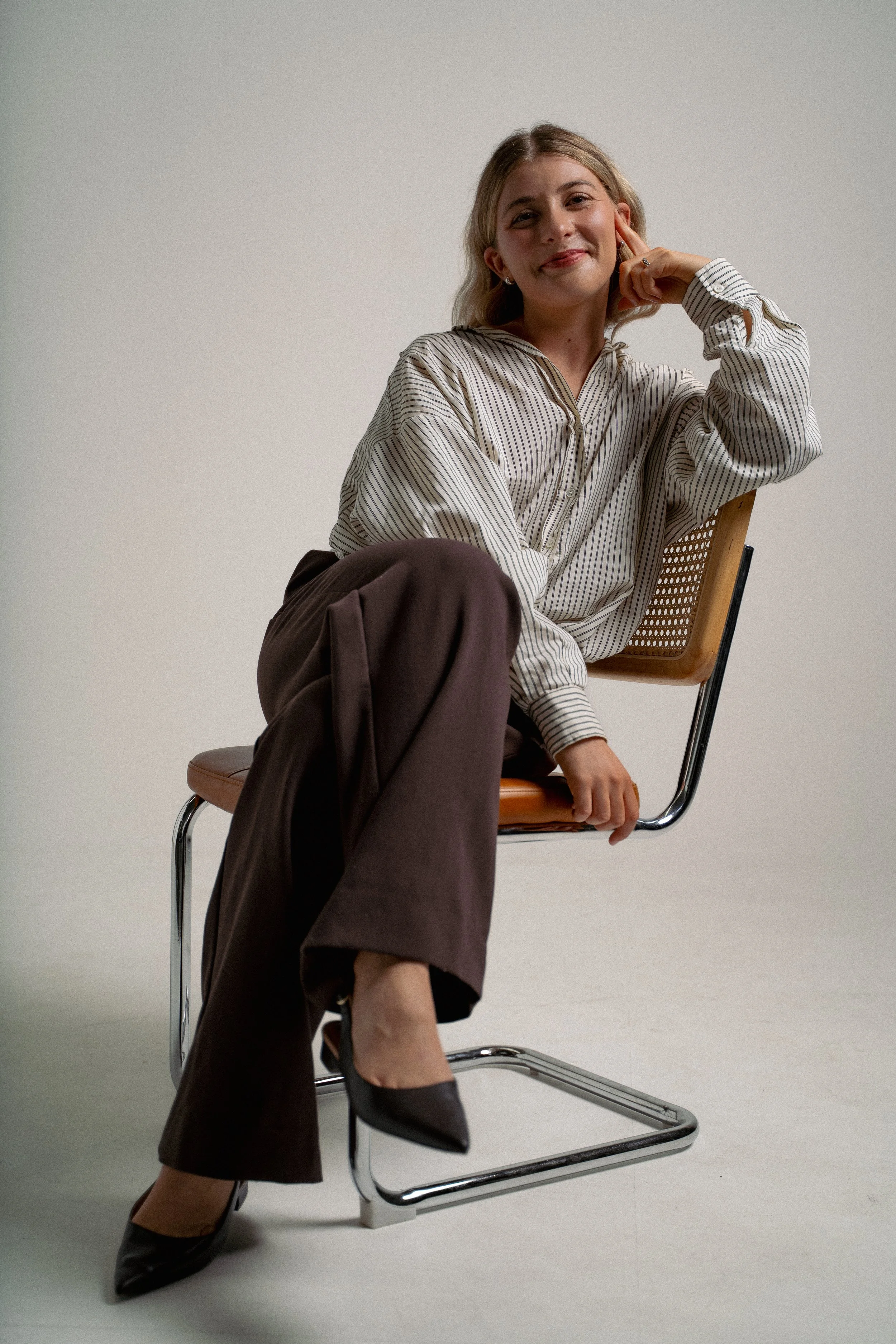 Issy from IS VIRTUAL, practice management consultant for psychologists, seated and looking at camera