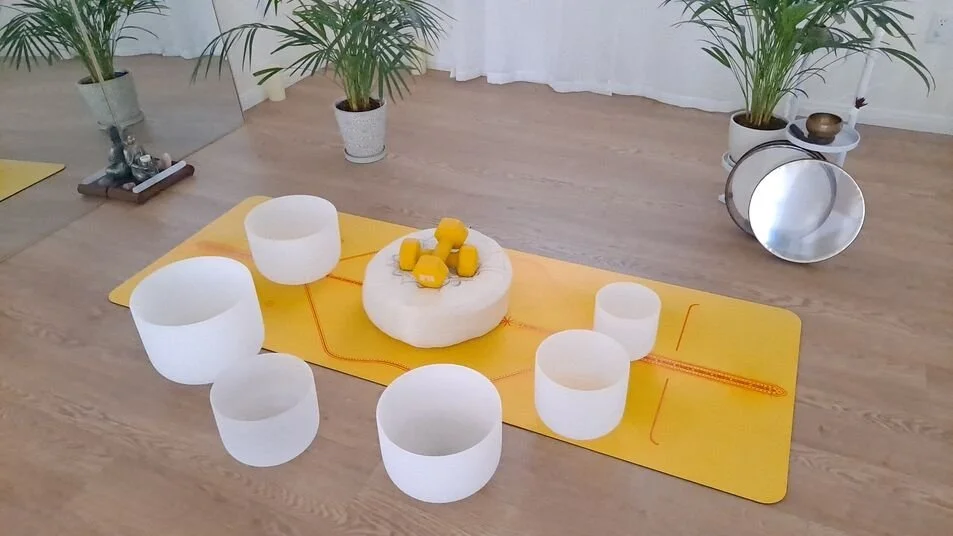 Crystal singing bowls arranged for a calming nervous system regulation session